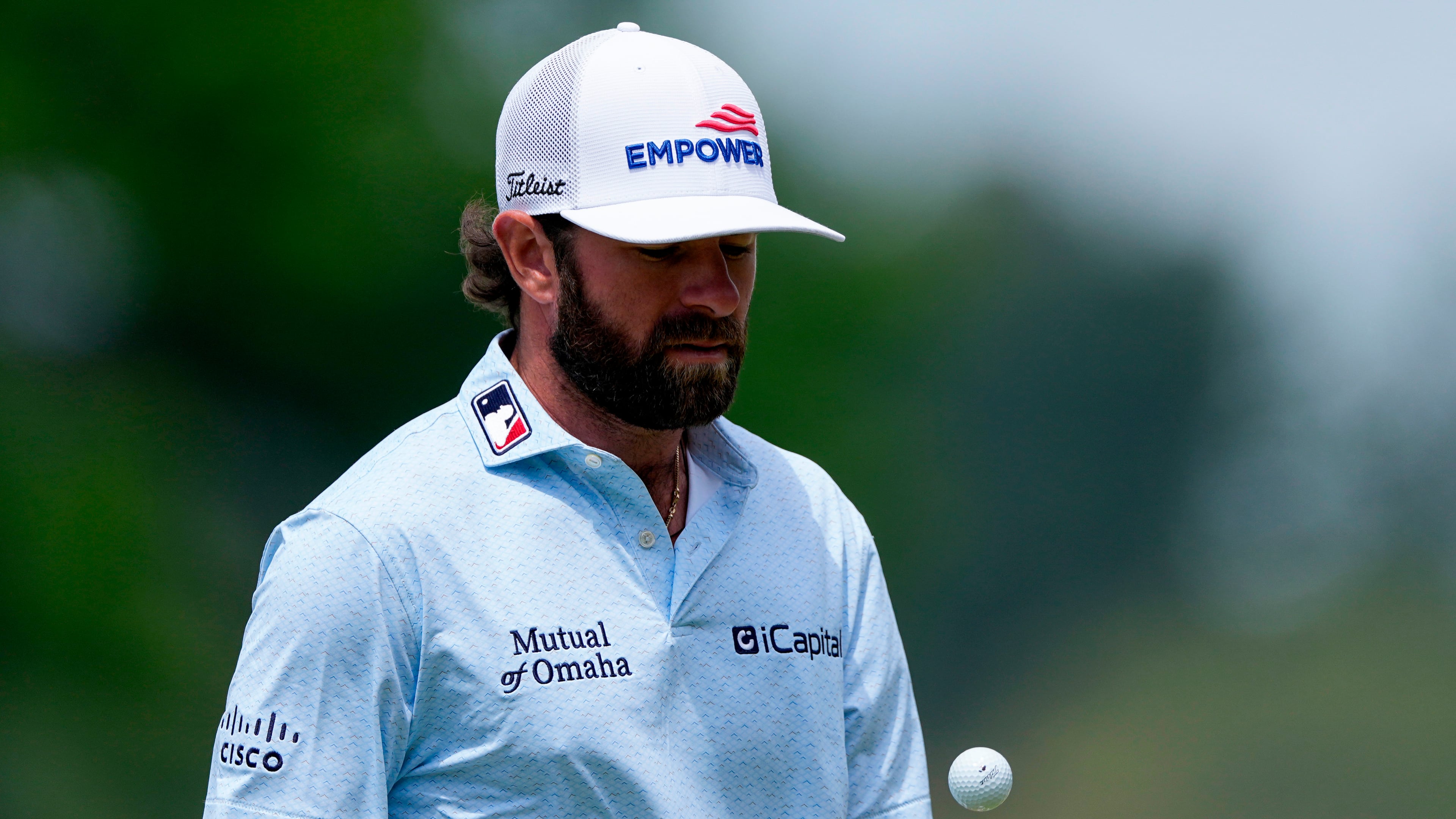 Cameron Young reacts tosses his ball on the fourth green during a PGA Championship golf tournament practice round at Aronimink Golf Club, Wednesday, May 13, 2026, in Newtown Square, PA. (AP Photo/Matt Slocum)