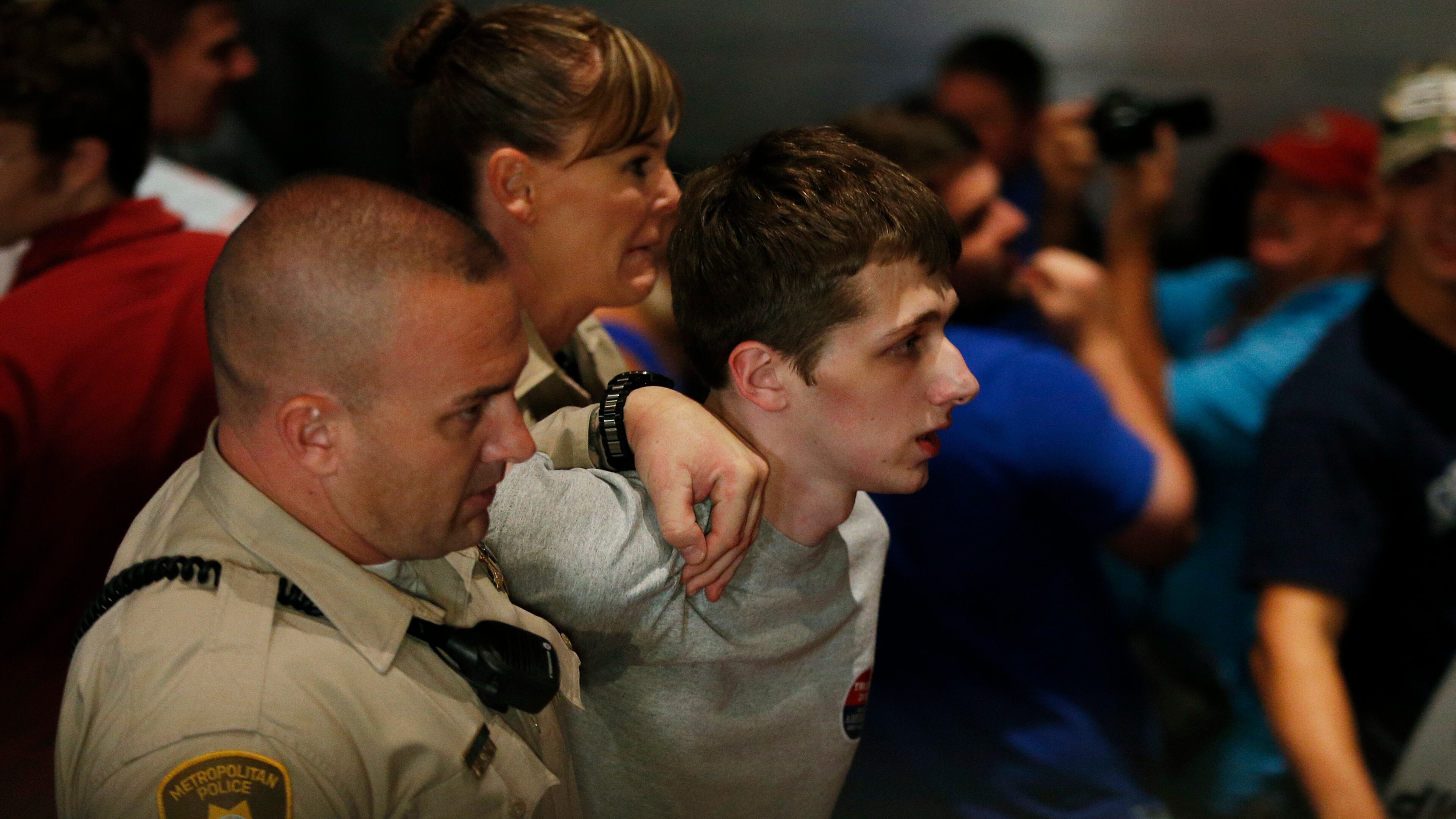 Police remove protestor Michael Steven Sandford (AP Photo/John Locher, File)