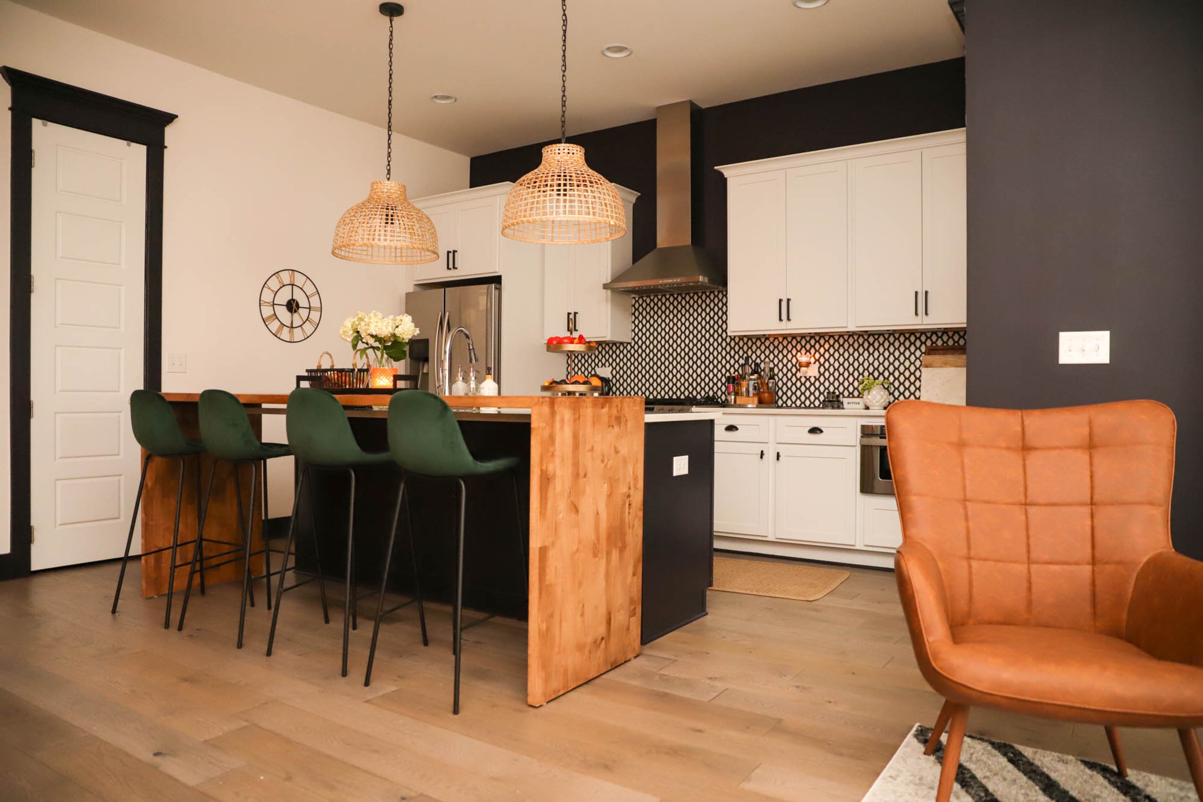 Originally, the two lights hanging above the kitchen island felt a bit too bright and “in your face” when sitting in the living room. Nirjary Desai decided to replace them with IKEA basket pendants that added a level of boho airiness and filtered some of the brightness. Reynolds Rogers/FOR THE AJC