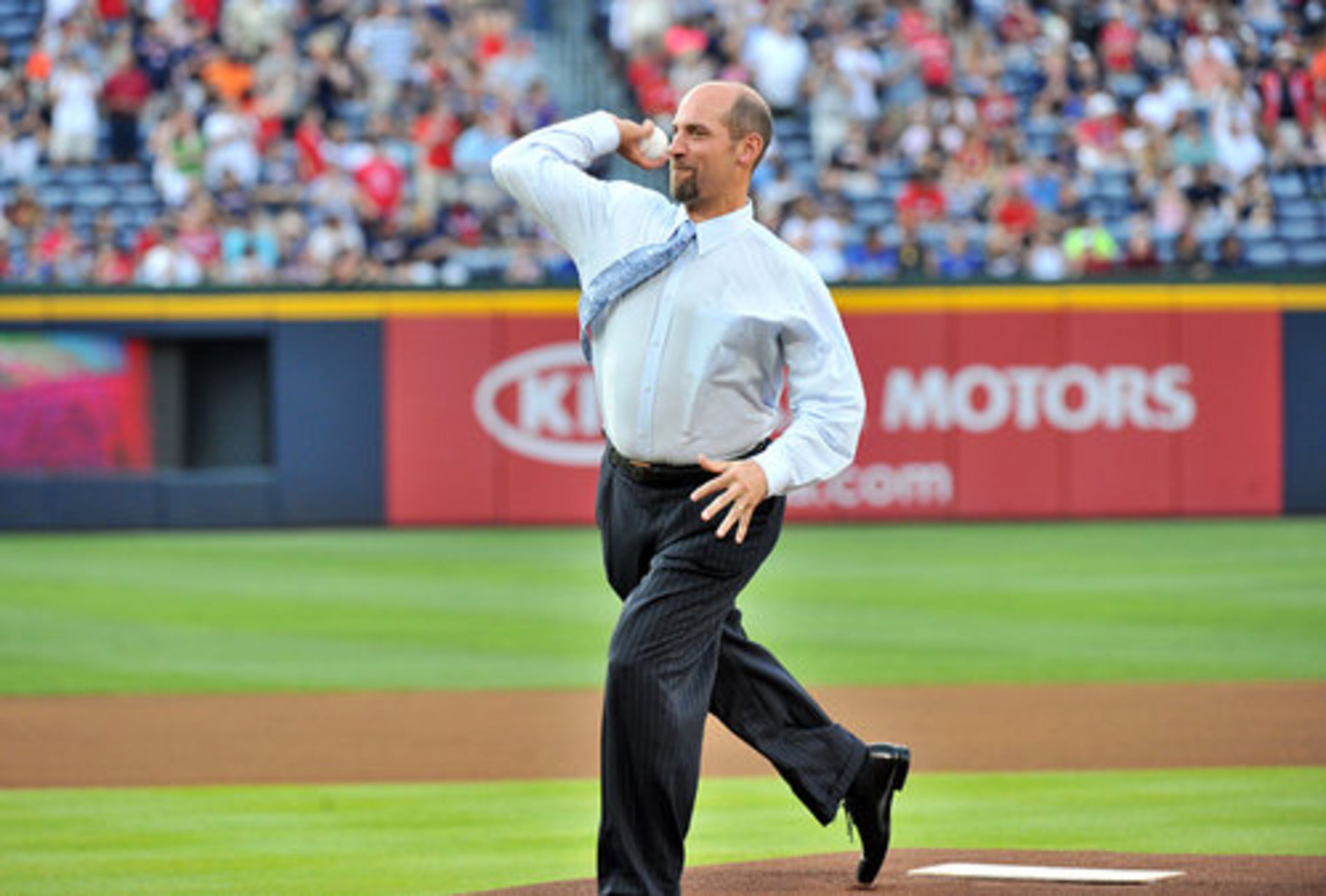 John Smoltz throws out the first pitch to start Friday's game.
