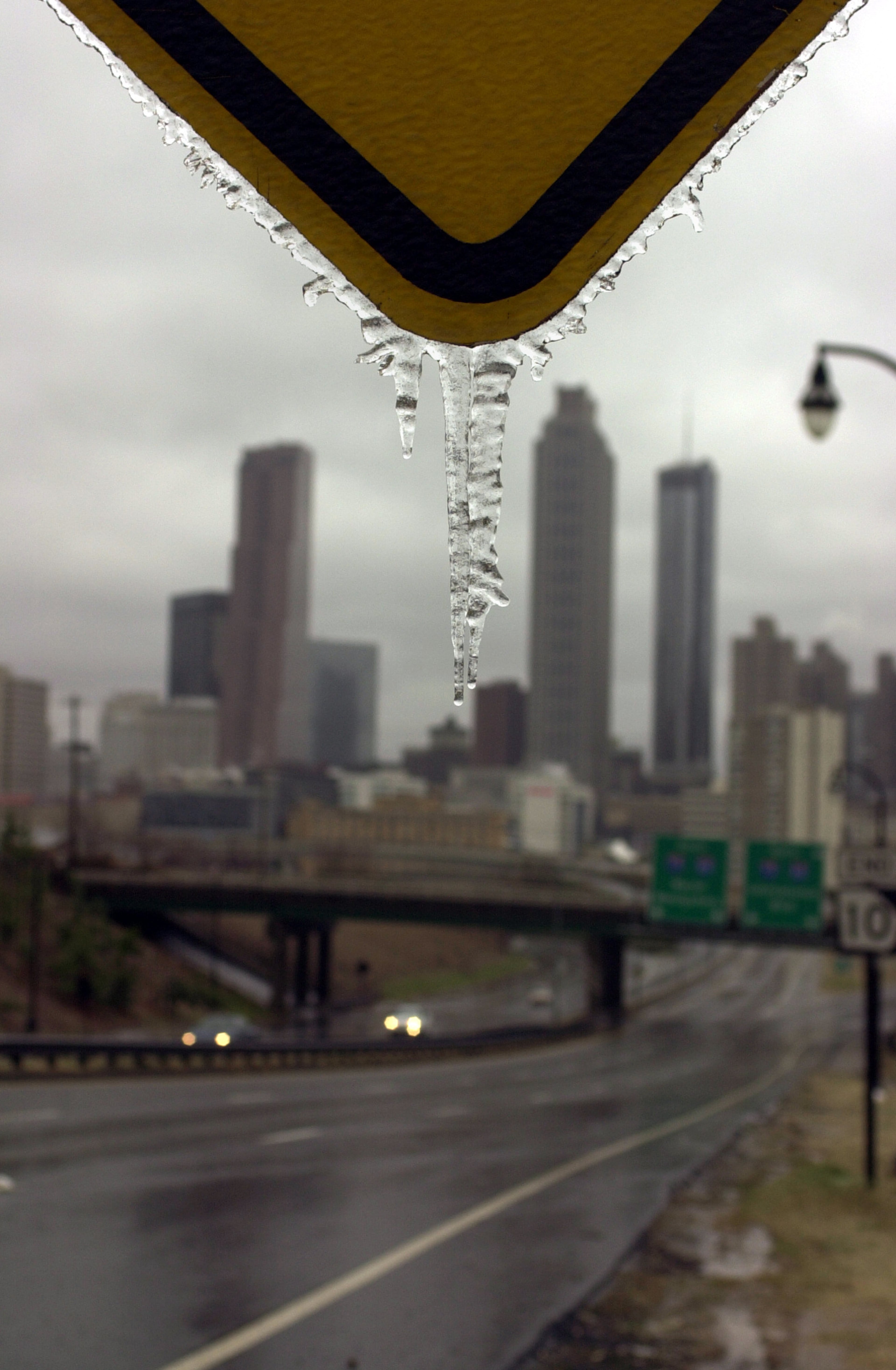An icicle hangs from a road sign along Freedom Parkway in Atlanta Saturday, January 29, 2000. Freedom Parkway heading into Atlanta was closed for part of the day due to icy conditions. (BRANT SANDERLIN/AJC staff)
