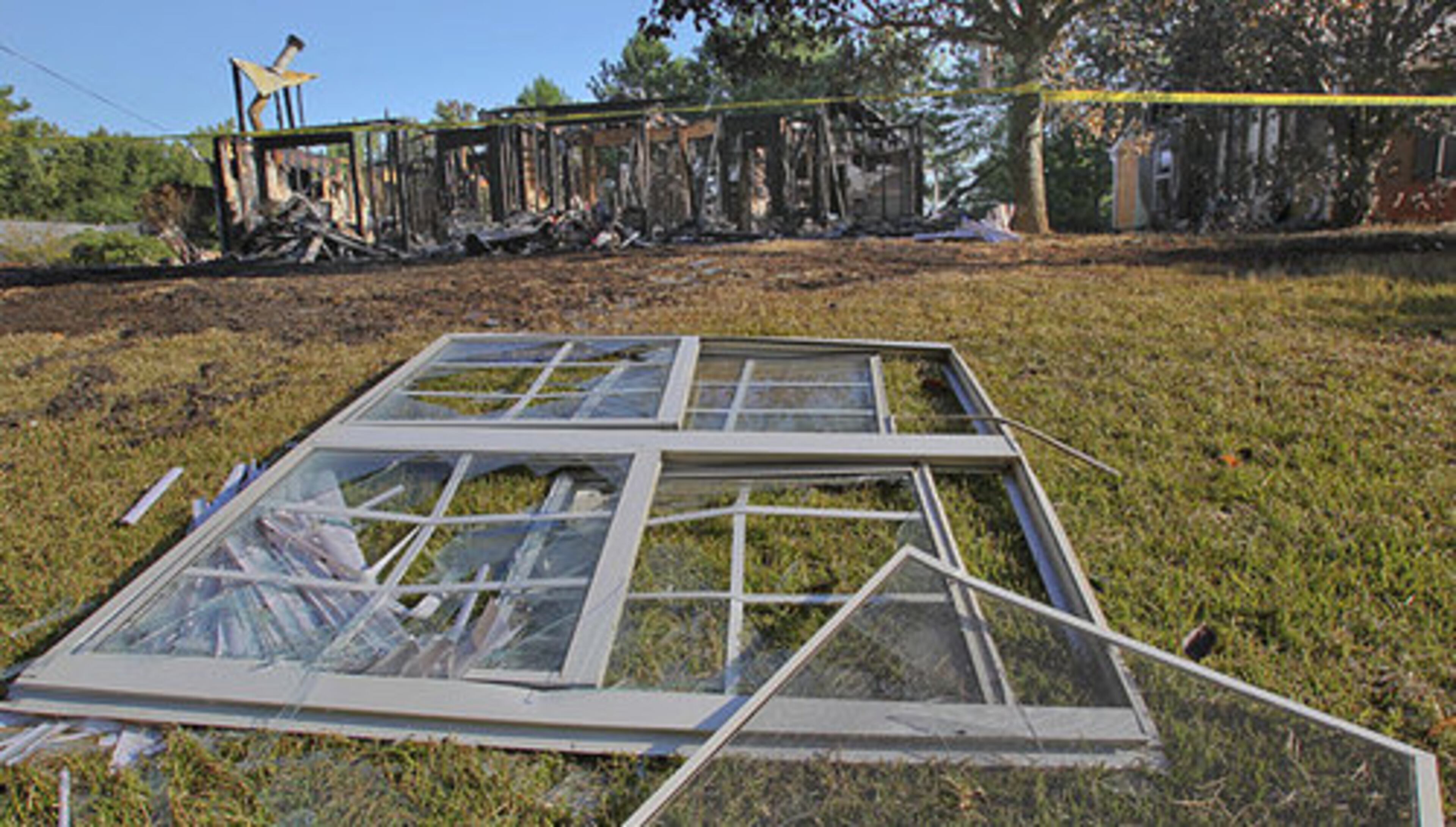 8650 Garvey Lane (left) and 5465 Milam Road (right) were taped off Monday after this weekend's explosion. Authorities said Monday they still had not identified two people killed in a south Fulton home explosion but that two children who lived in the house have been found alive and well.