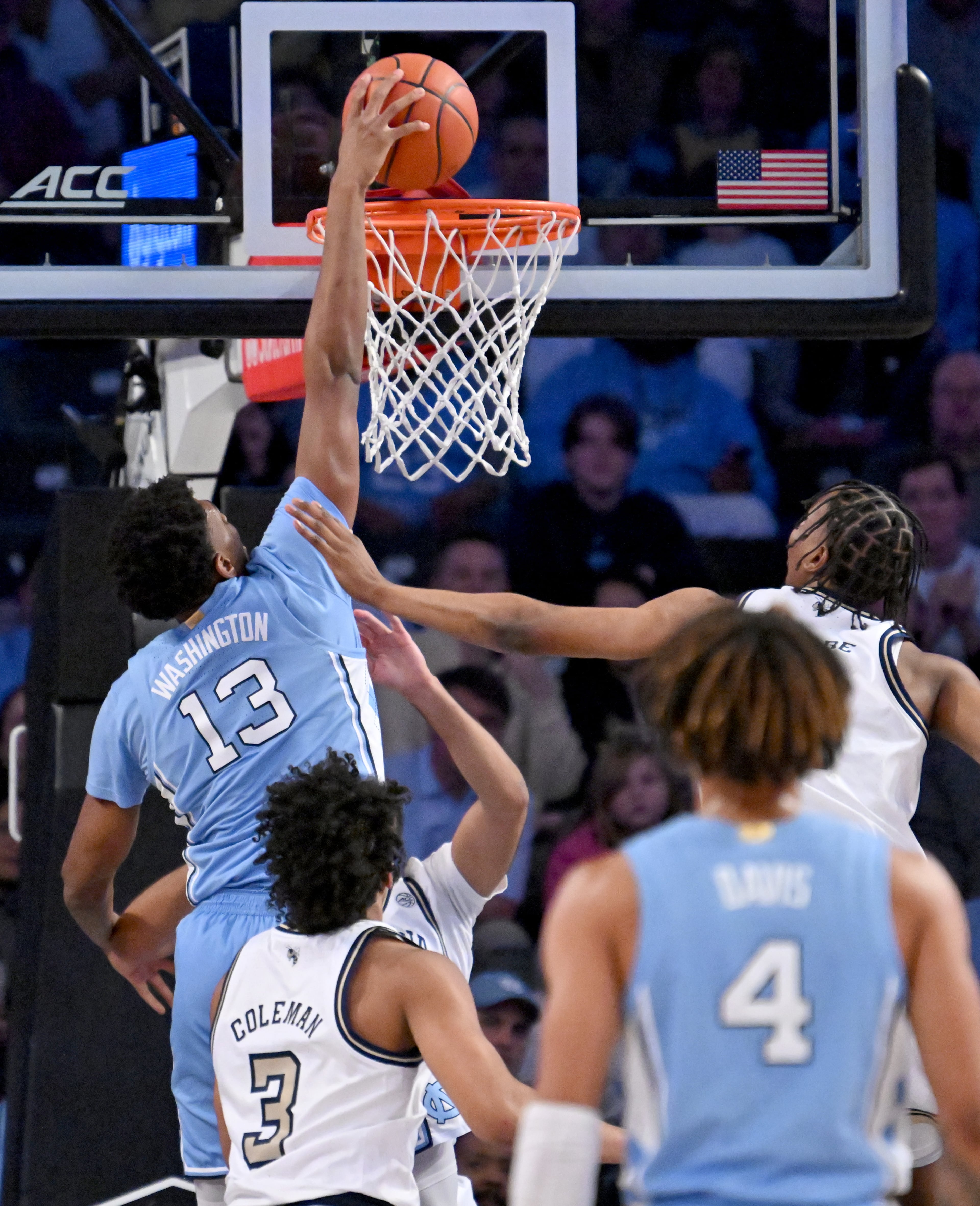 North Carolina forward Jalen Washington (13) dunks over Georgia Tech guard Kyle Sturdivant (1) during the first half of an NCAA college basketball game at Georgia Tech’s McCamish Pavilion, Tuesday, January 30, 2024, in Atlanta. (Hyosub Shin / Hyosub.Shin@ajc.com)
