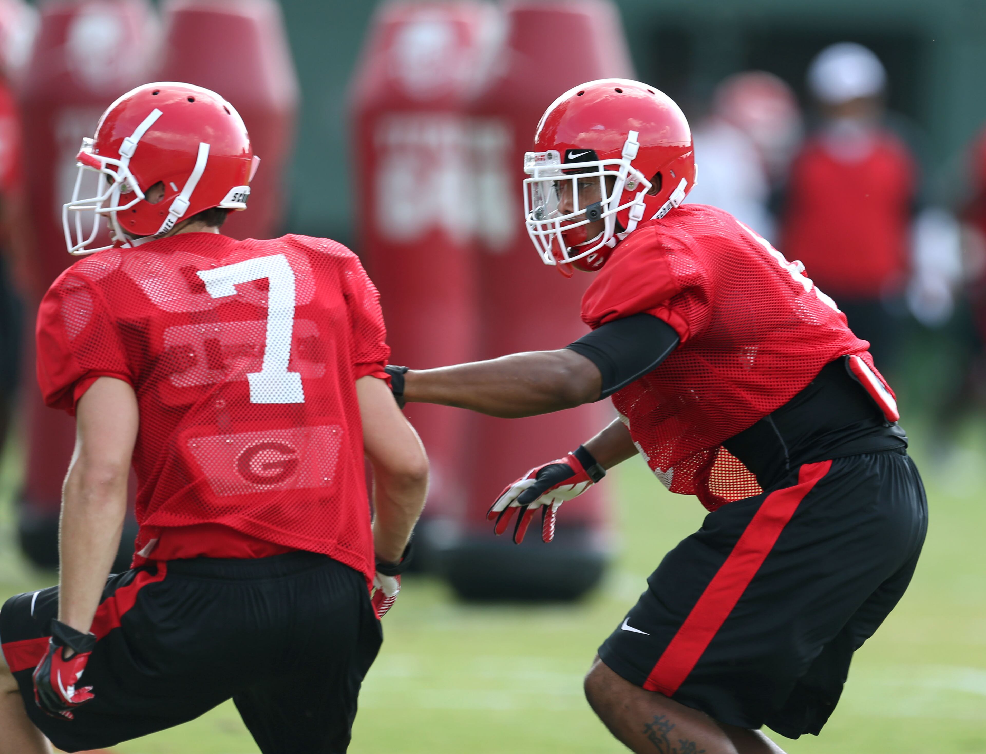 University of Georgia cornerback Brendan Langley (4, right) participates in a drill with cornerback Blake Sailors (7) during preseason practice at the University of Georgia Tuesday afternoon in Athens.