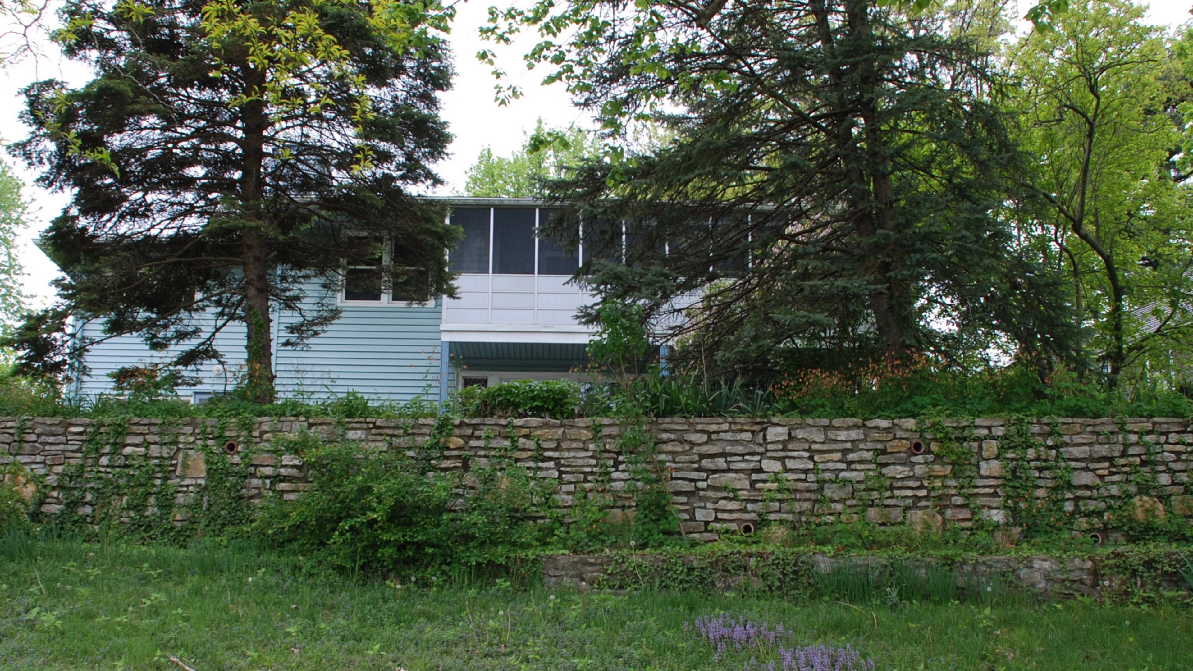 The poor little house is half dressed in its new wood shingles, surrounded by a sea of mud and accented with a big green dumpster. (Mary Carol Garrity/TNS)