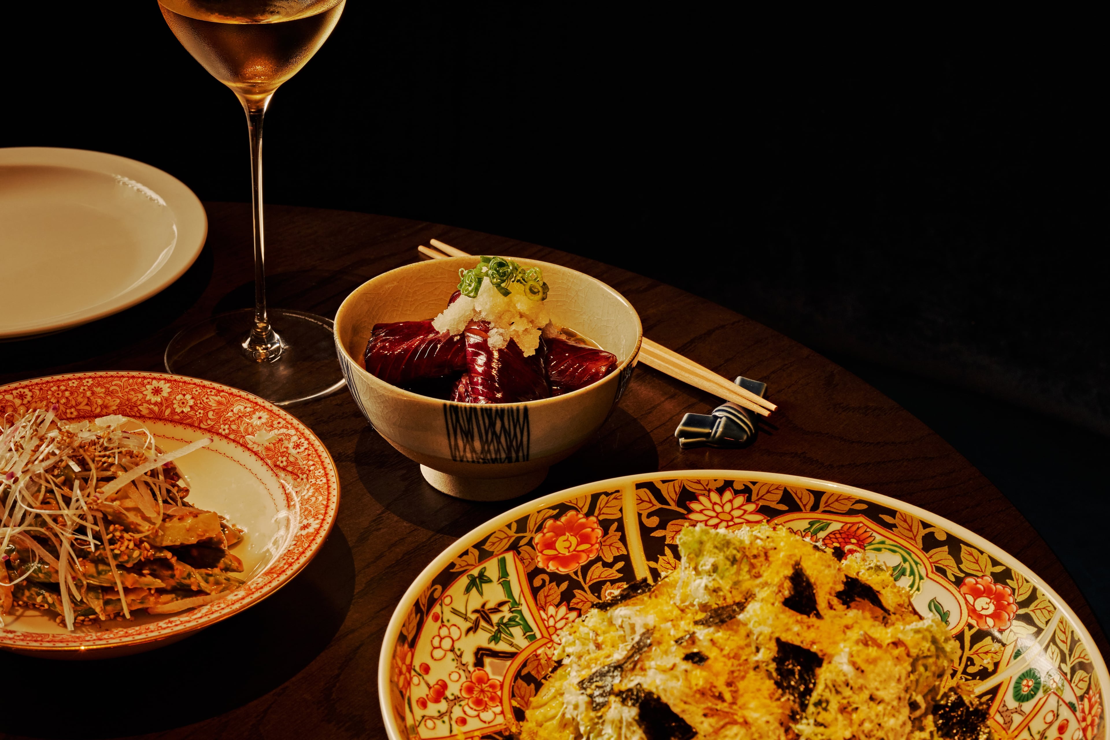 A selection of side dishes from Koshu Club, including green beans goma-ae (left), an eggplant dish called nasu agebitashi (center) and yamitsuki cabbage (right). (Andrew Thomas Lee/Courtesy of Koshu Club)