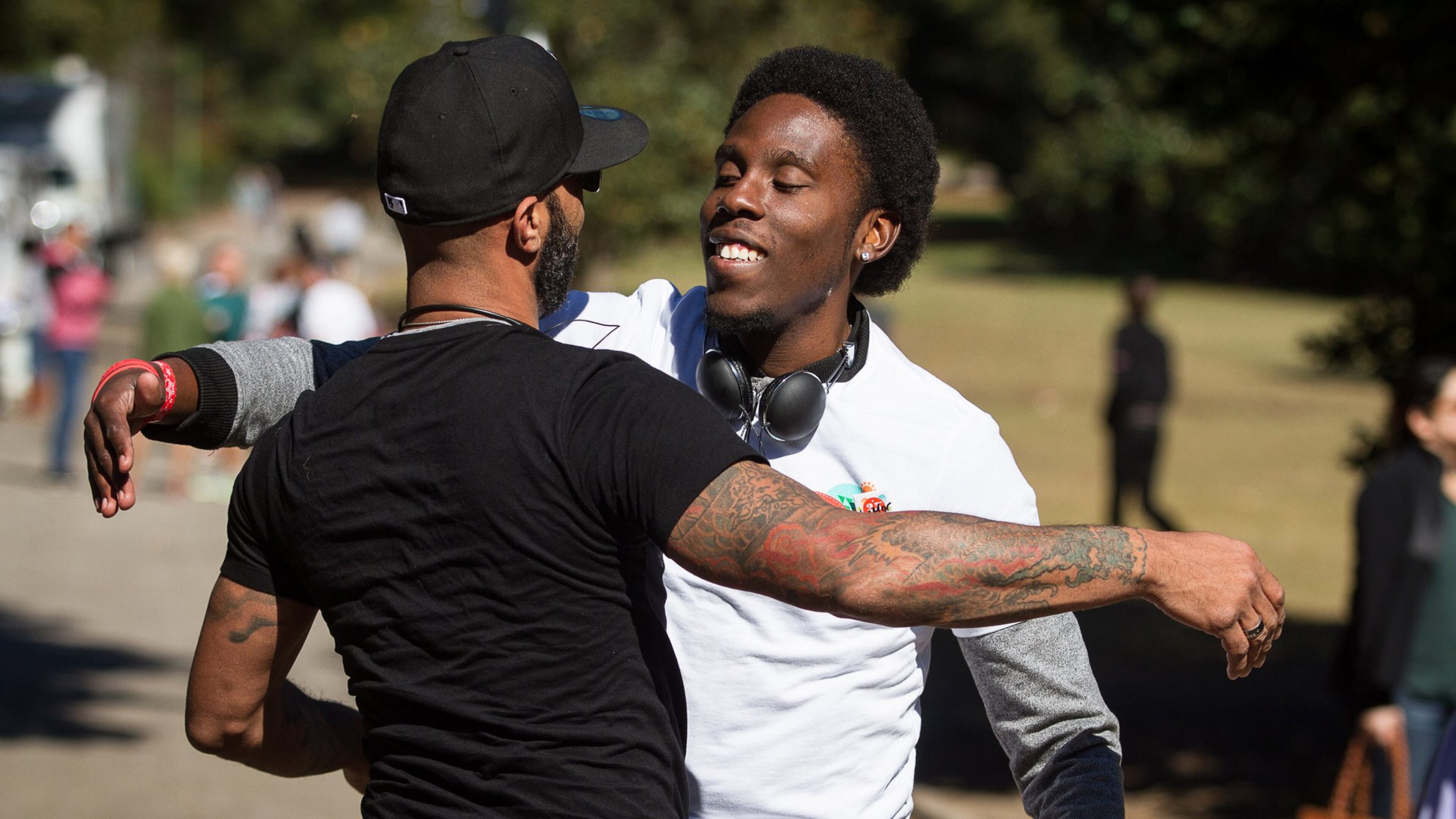 LaMar Yarborough greets a friend while volunteering at the 25th Annual AIDS Walk Atlanta & 5K Run in Piedmont Park Sunday, October 18, 2015. STEVE SCHAEFER / SPECIAL TO THE AJC