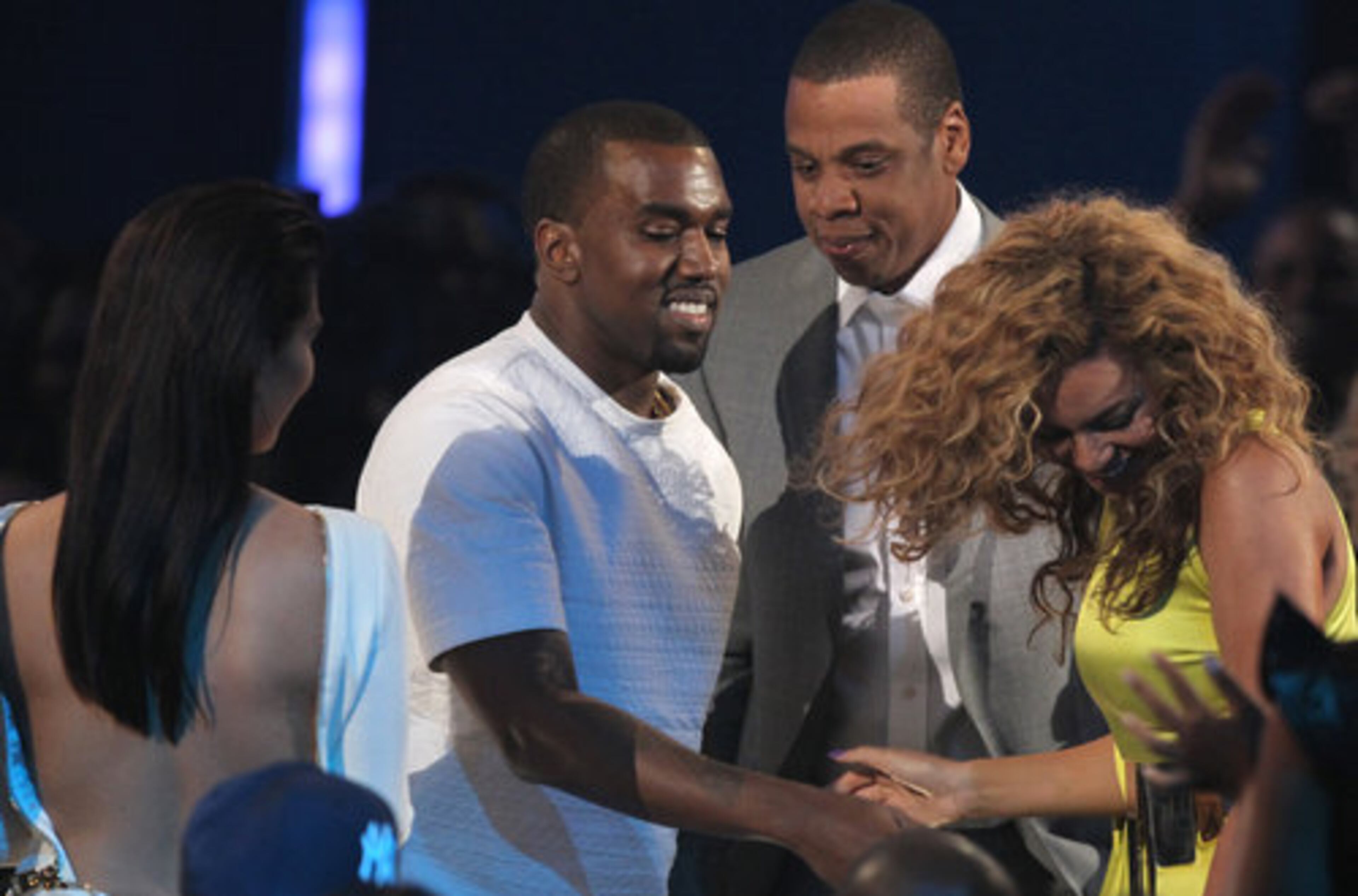 Kim Kardashian (left) and Beyonce (right) make way for Kanye West and Jay-Z after they won the ceremony's top prize, earning video of the year for "Otis."