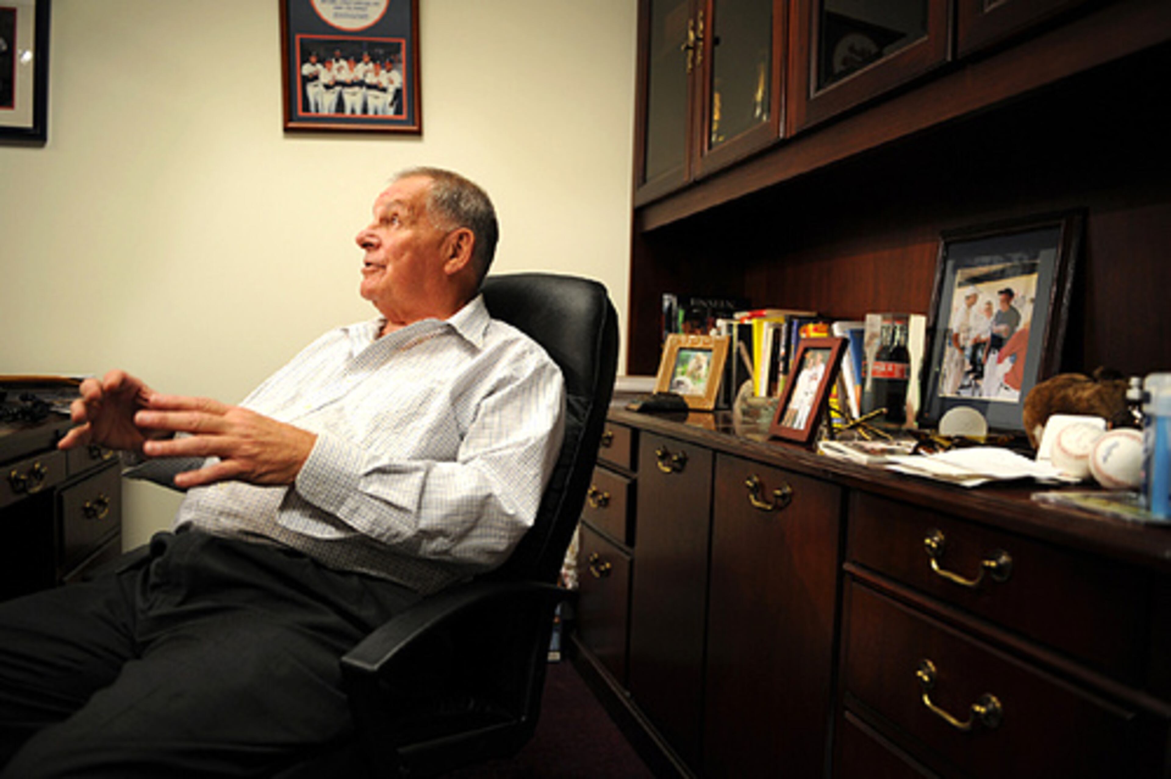 Braves manager Bobby Cox answers questions from the media in his office.