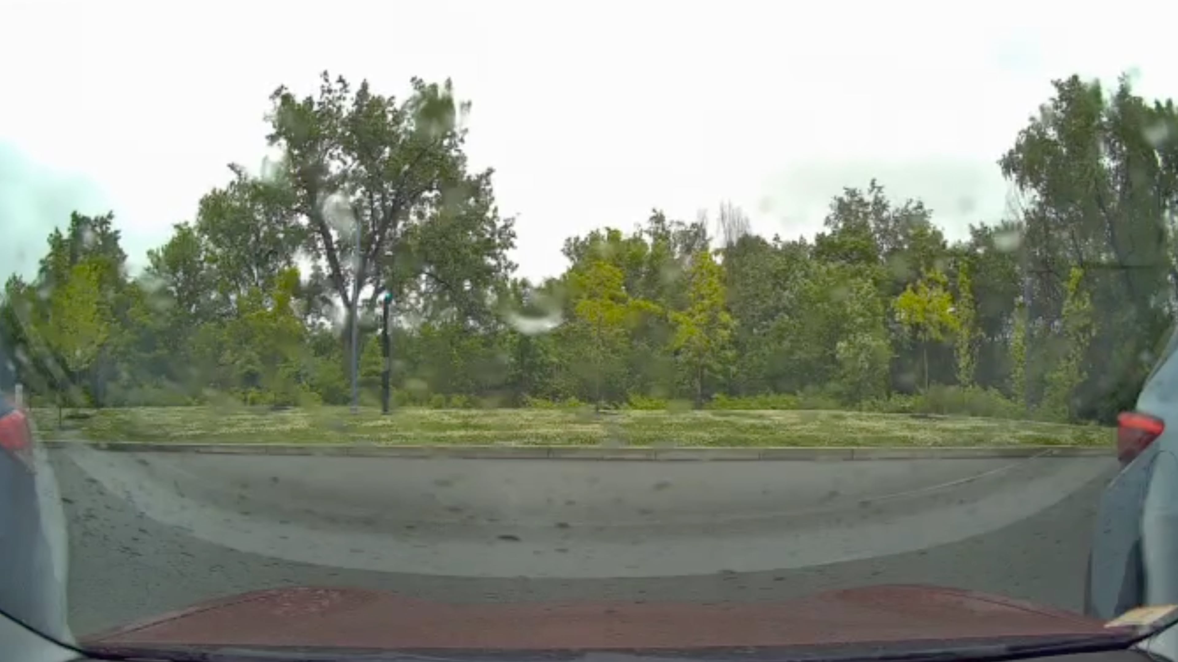This image taken from video shows a view from a car dashcam when a meteor produced two loud booms over Cambridge, Mass., Saturday, May 30, 2026. (Stanley Fung via AP)