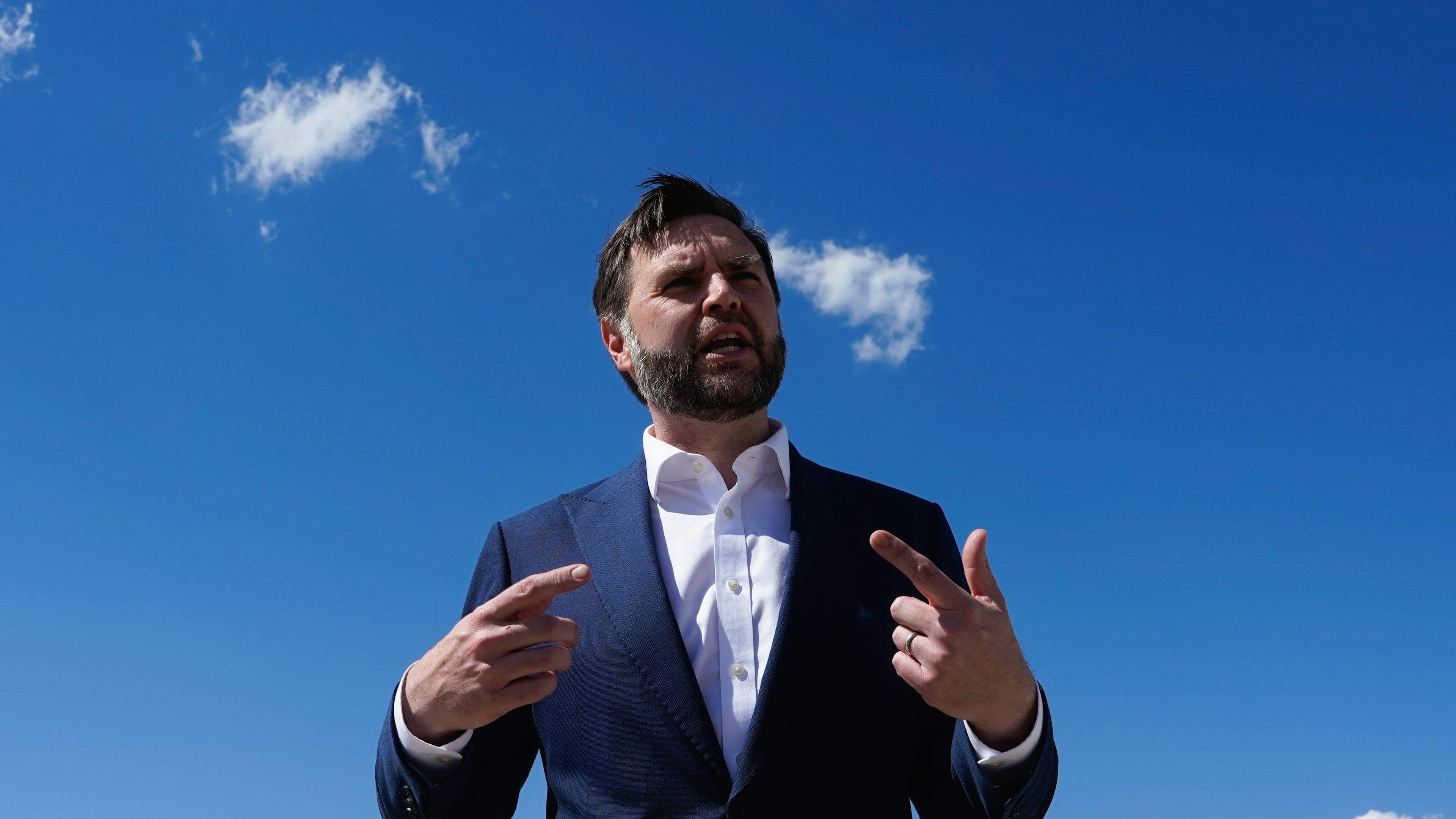 Vice President JD Vance speaks to reporters at Joint Base Andrews, Md., Saturday, June 20, 2026, en route to Switzerland. (Elizabeth Frantz/Pool Photo via AP)