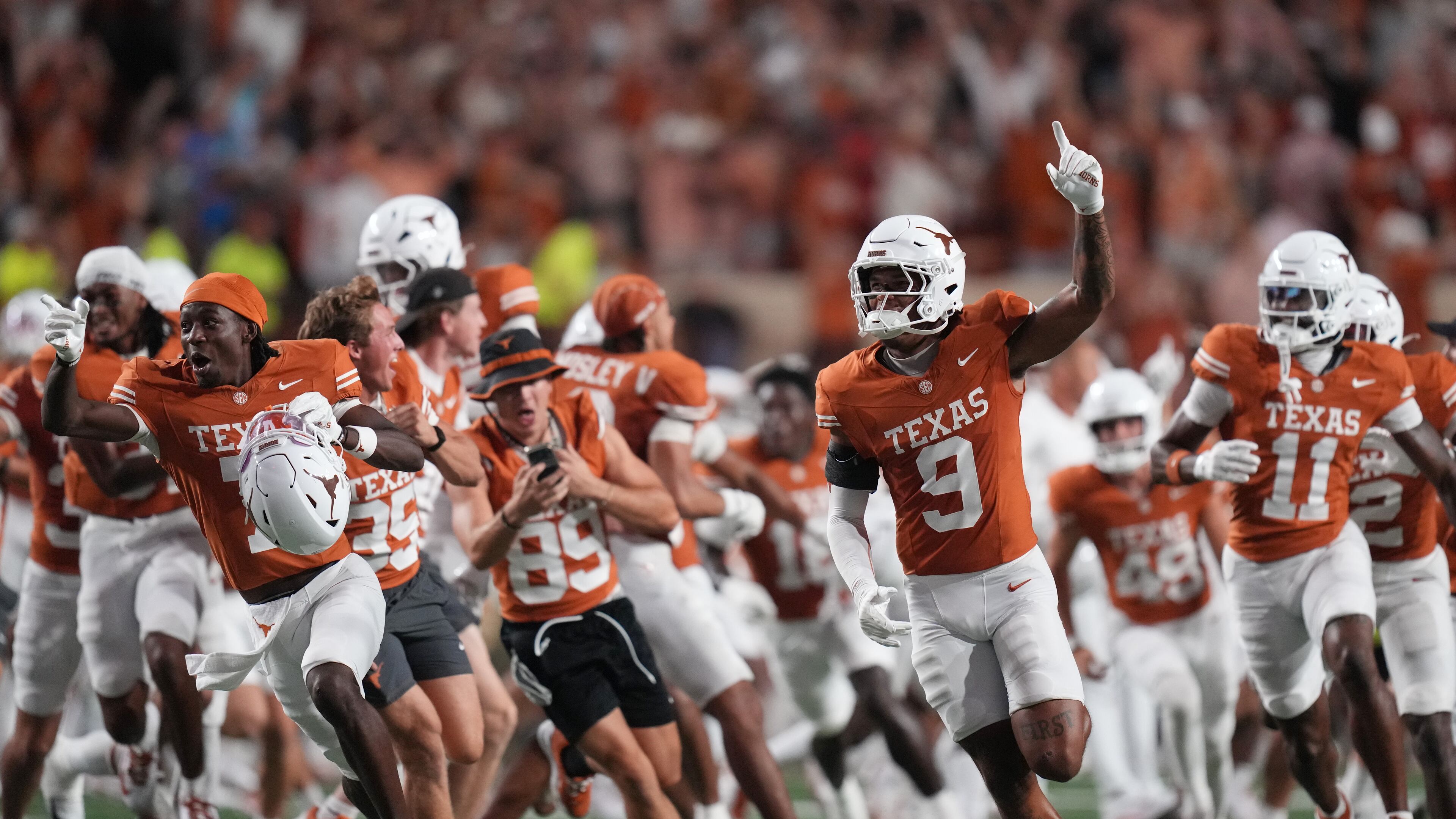 Texas players celebrate their win over Ohio State in an NCAA college football game in Austin, Texas, Saturday, Sept. 12, 2026. (AP Photo/Eric Gay)