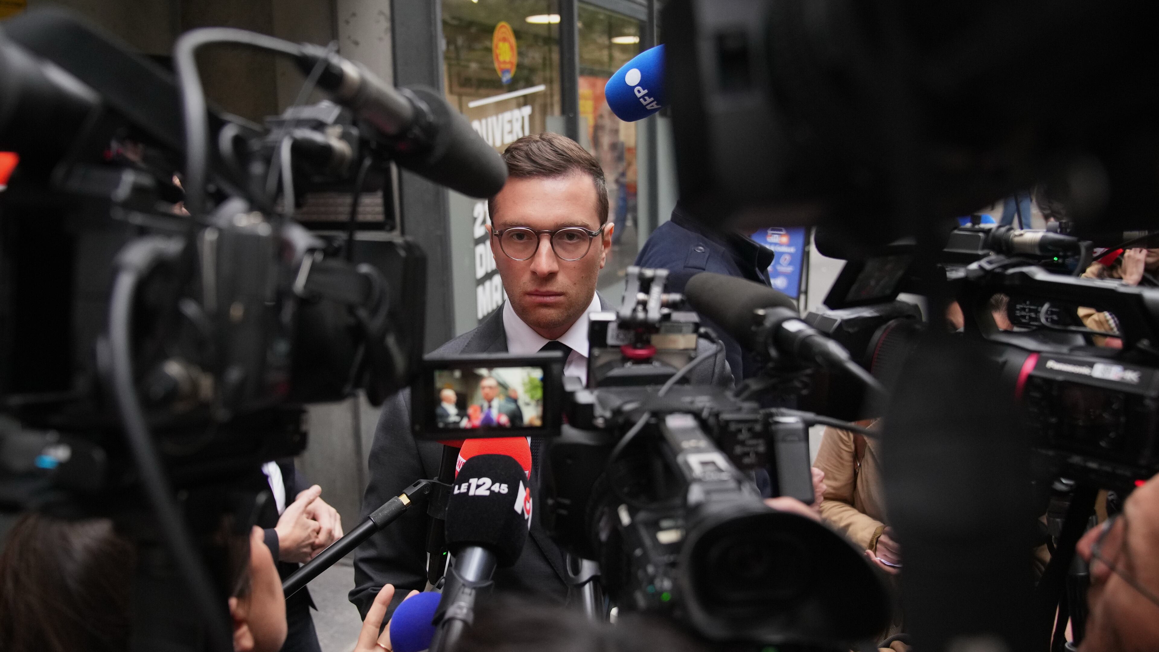 FILE - French far right National Rally party president Jordan Bardella answers reporters following a meeting, on Monday, Oct. 6, 2025 in Paris. (AP Photo/Christophe Ena, File)