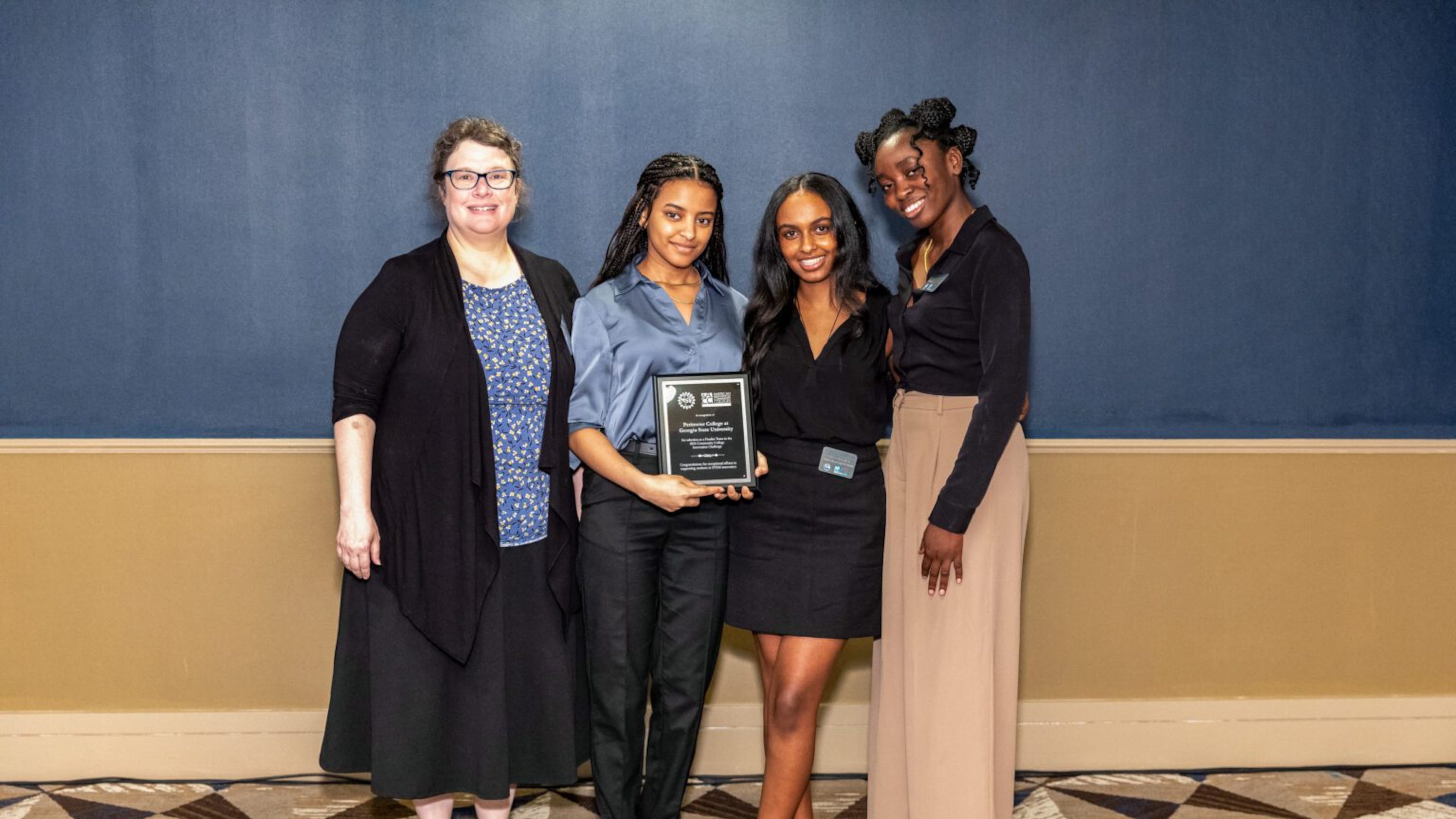 The Perimeter College team of (left to right) mentor Janna Blum and students Sophia Bereket, Rakeb Tesfassellasie and Shalom Ejiwunmi won the 2024 Community College Innovation Challenge Boot Camp in Washington, D.C. (Courtesy of Phi Theta Kappa)