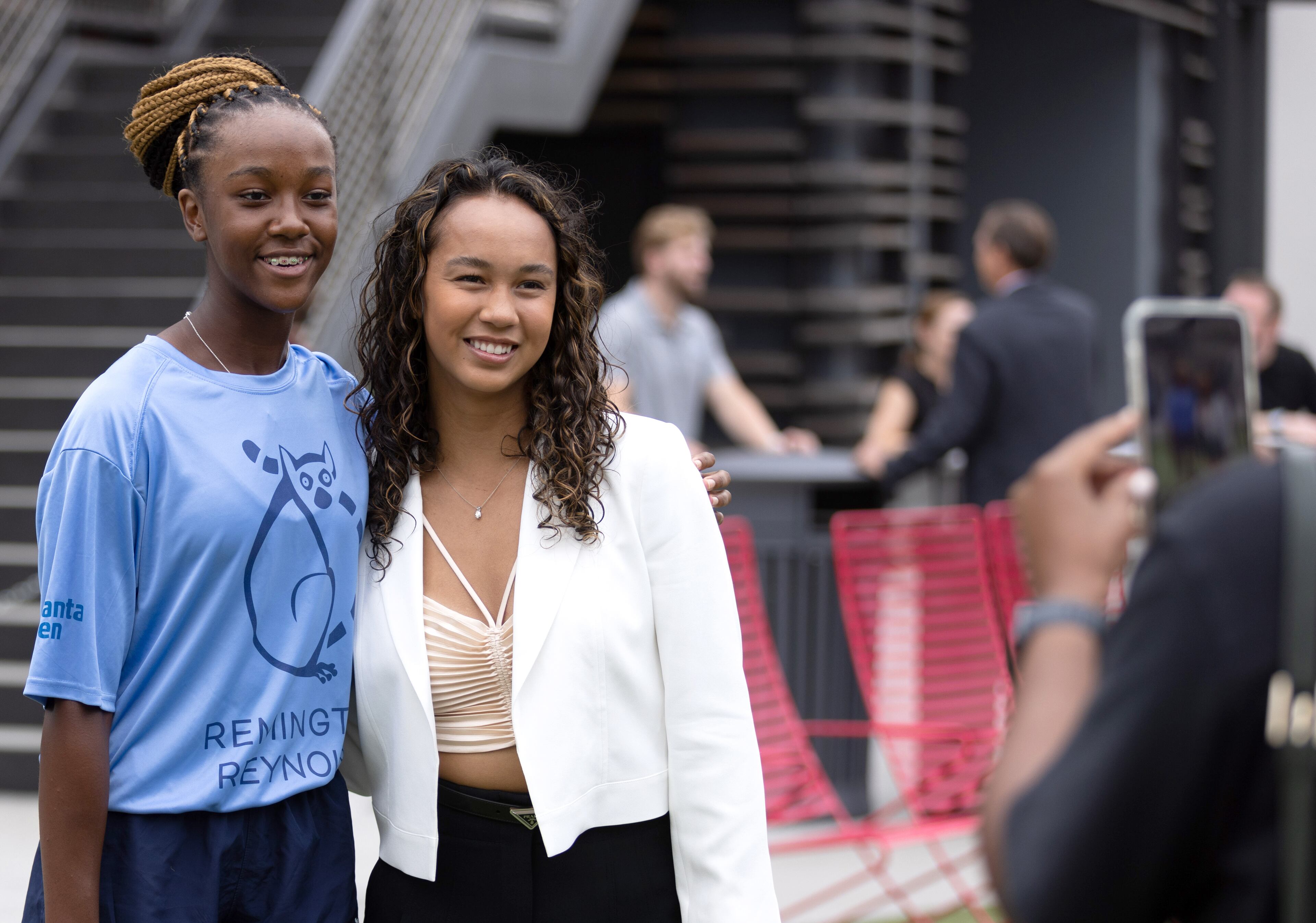 21-year-old Canadian tennis player Leylah Fernandez poses for a photograph with one of the official Ball Kids before the start of the Atlanta Open Media Day at Atlantic Station Tuesday, June 28, 2022. (Steve Schaefer / steve.schaefer@ajc.com)