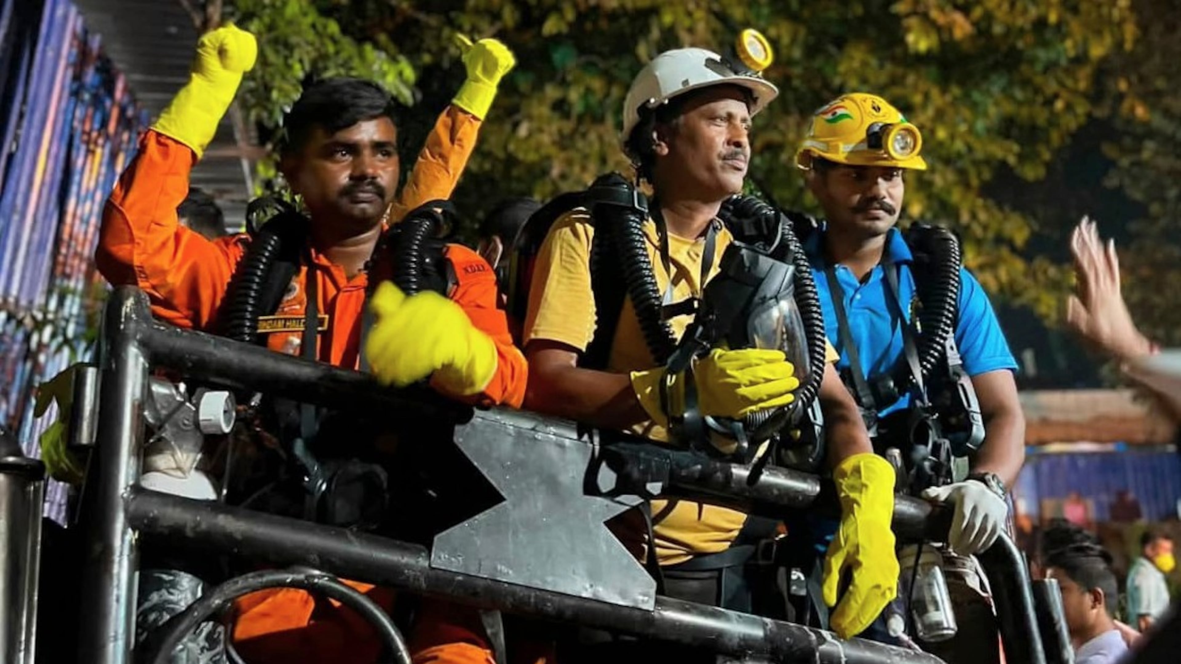In this image provided by the Information and Public Relations Department, Government of Sikkim, rescue workers stand outside an under-construction tunnel at a hydropower project in Samardung village, about 40 kilometers (25 miles) from Gangtok, India, Wednesday, July 22, 2026. (Government of Sikkim via AP)