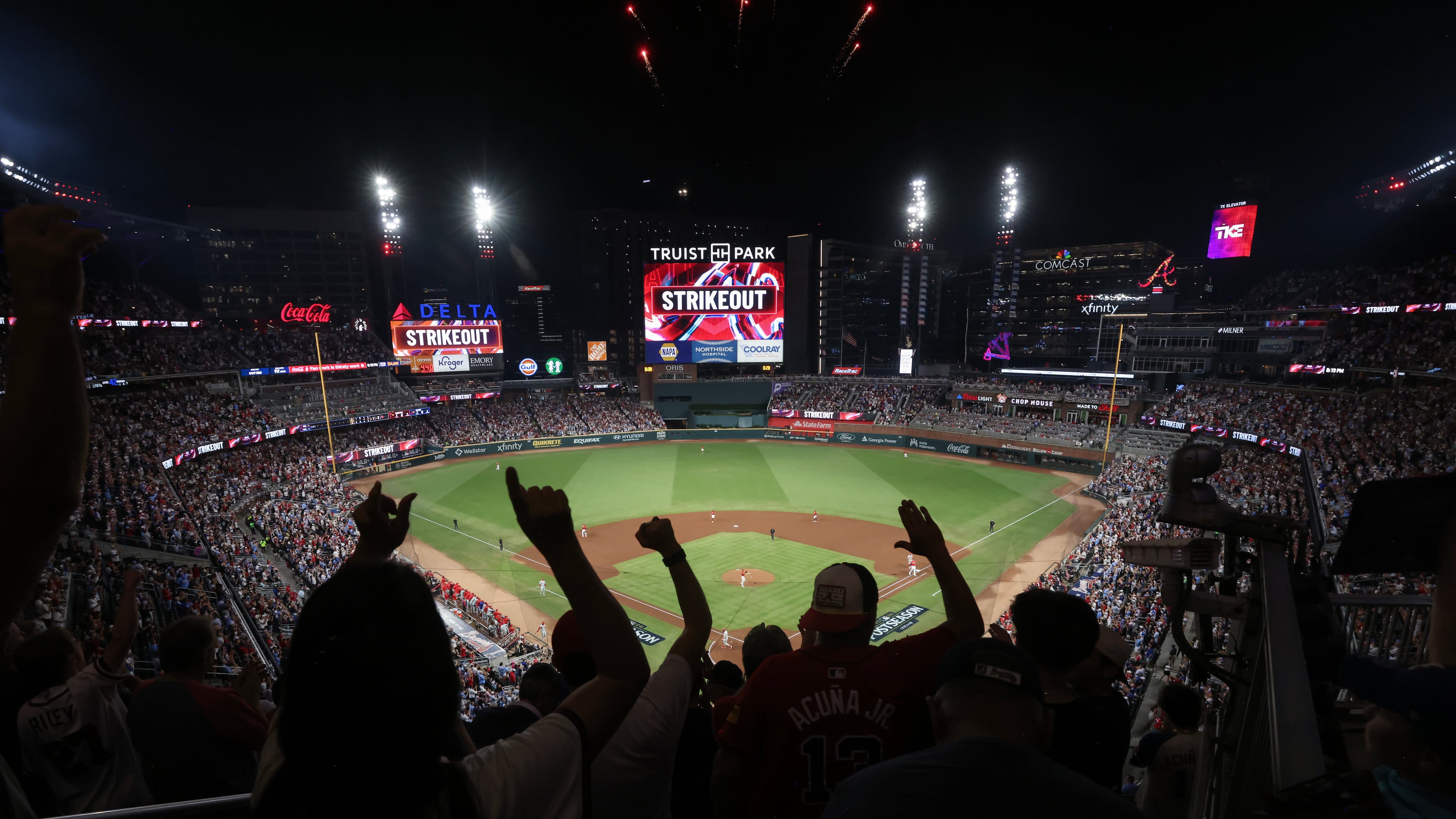 Atlanta Braves fans cheer after Braves starting pitcher Ray Kerr strikes out Philadelphia Phillies' Bryce Harper during the first inning of Game 3 of the MLB National League Wild Card playoff series between the Braves and the Phillies, Thursday, Oct. 1, 2026, in Atlanta. (Jason Getz/AJC)