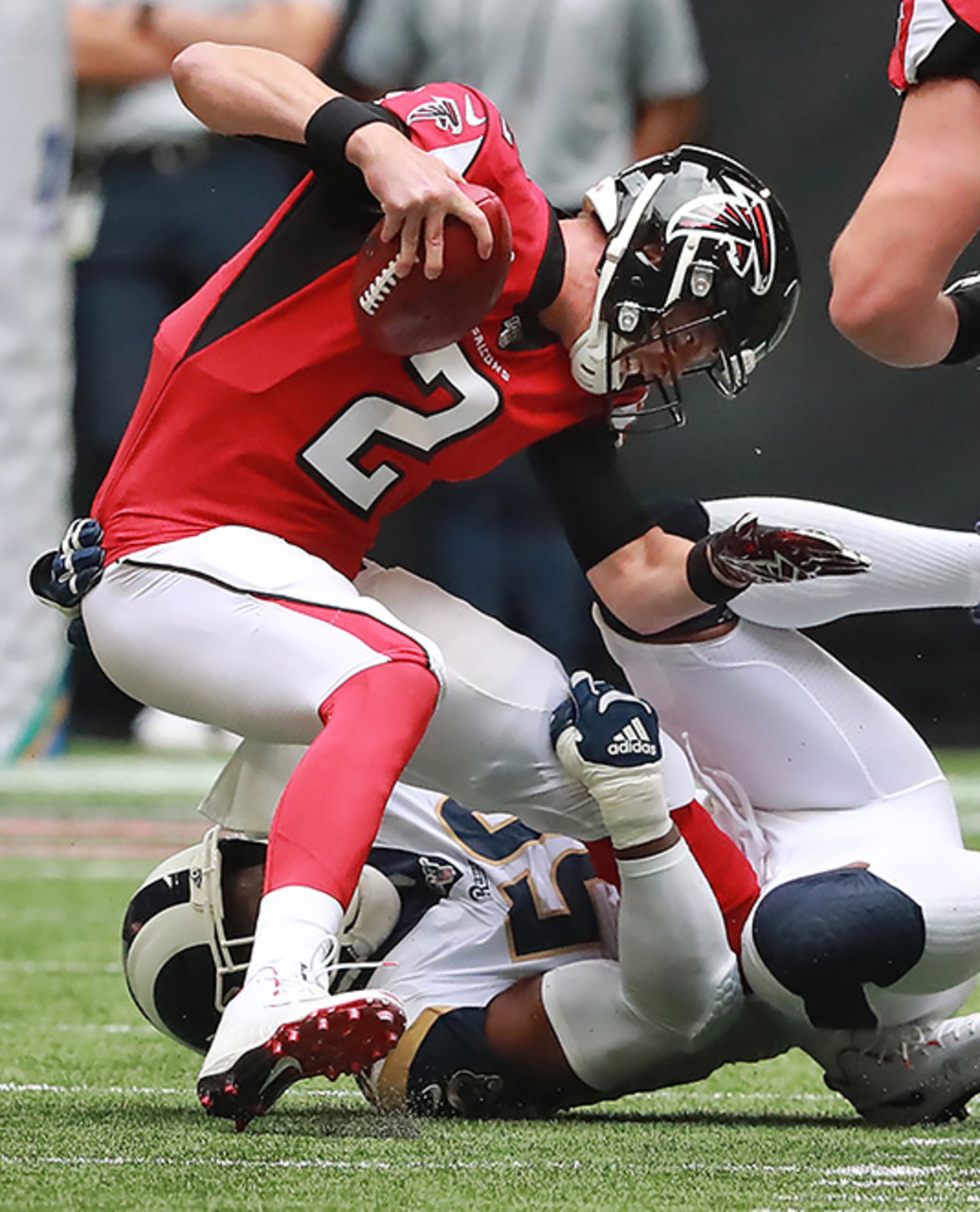 Falcons quarterback Matt Ryan is sacked by the Rams' Dante Fowler Jr. for the first of two back-to-back sacks during the first quarter Sunday, Oct. 20, 2019, at Mercedes-Benz Stadium in Atlanta.