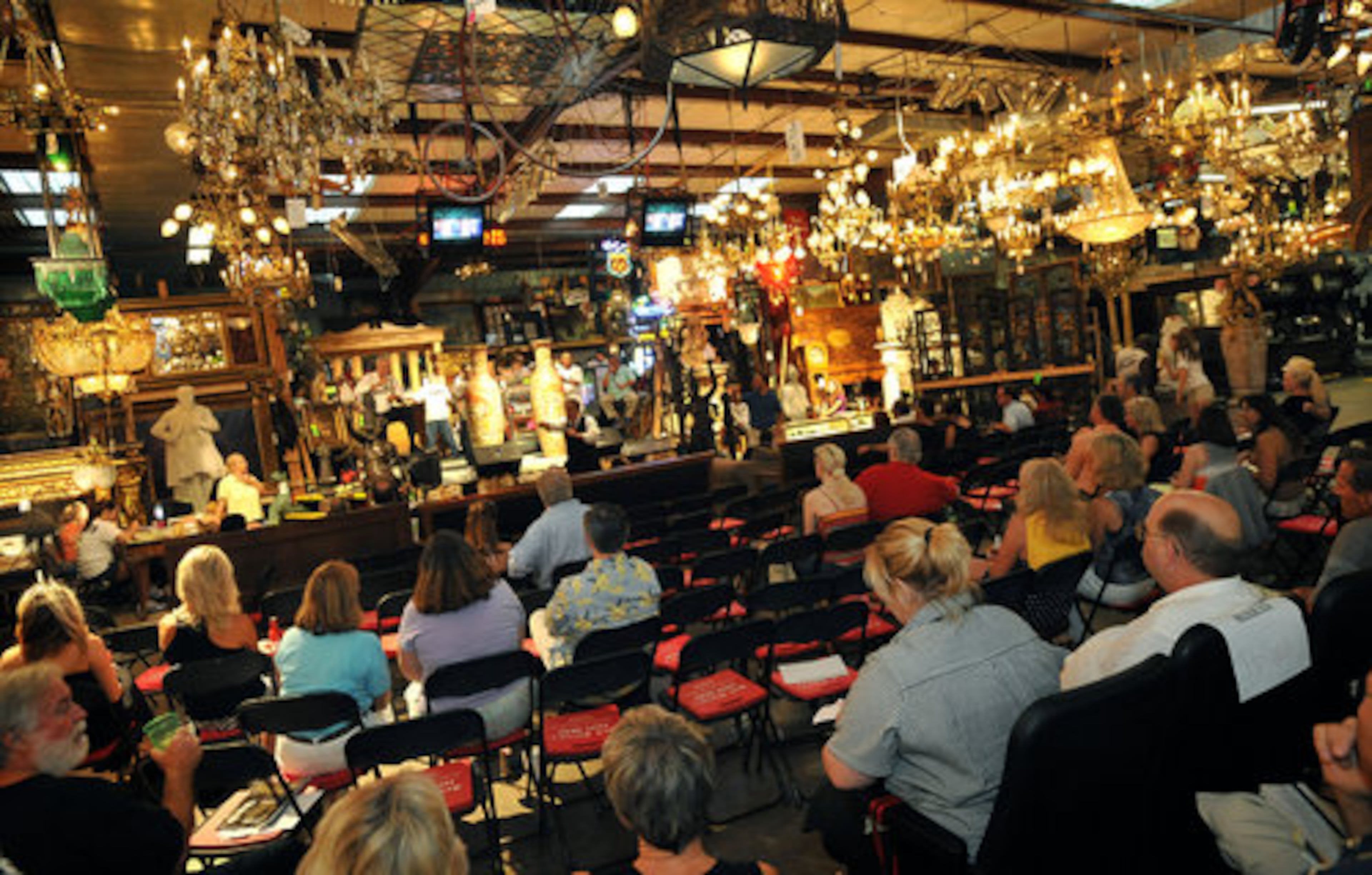 The capacity crowd bids for items including rare collections from around the world.