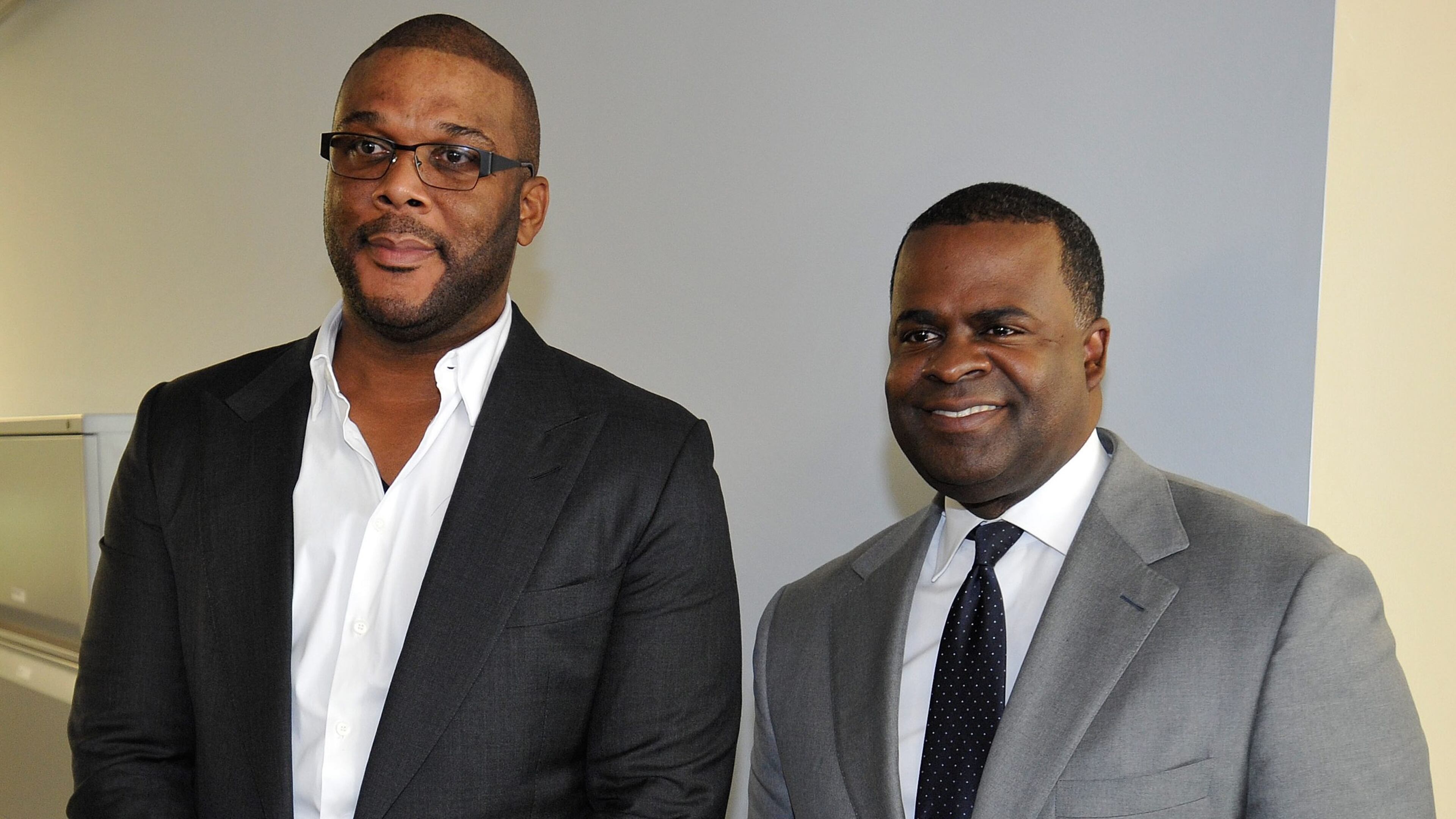 Atlanta Mayor Kasim Reed, and filmmaker Tyler Perry at the event announcing Perry's purchase of 330 acres at the former Fort McPherson Army base on Aug. 8, 2014, in Atlanta. AJC file photo: David Tulis
