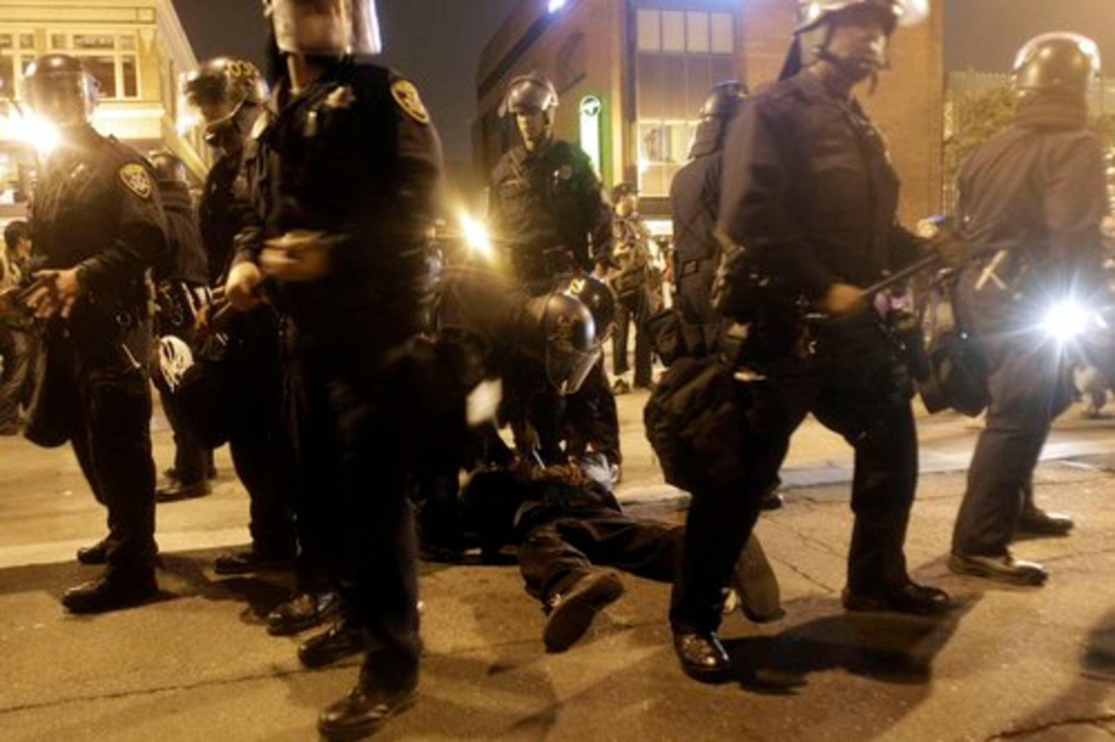 Oakland Police officers hold a demonstrator in Oakland, Calif., after a guilty verdict for Johannes Mehserle, Thursday, July 8, 2010. Former San Francisco Bay Area Rapid Transit police officer Johannes Mehserle was found guilty in Los Angeles for shooting unarmed black man Oscar Grant on New Year's Day 2009 at a BART station in Oakland.