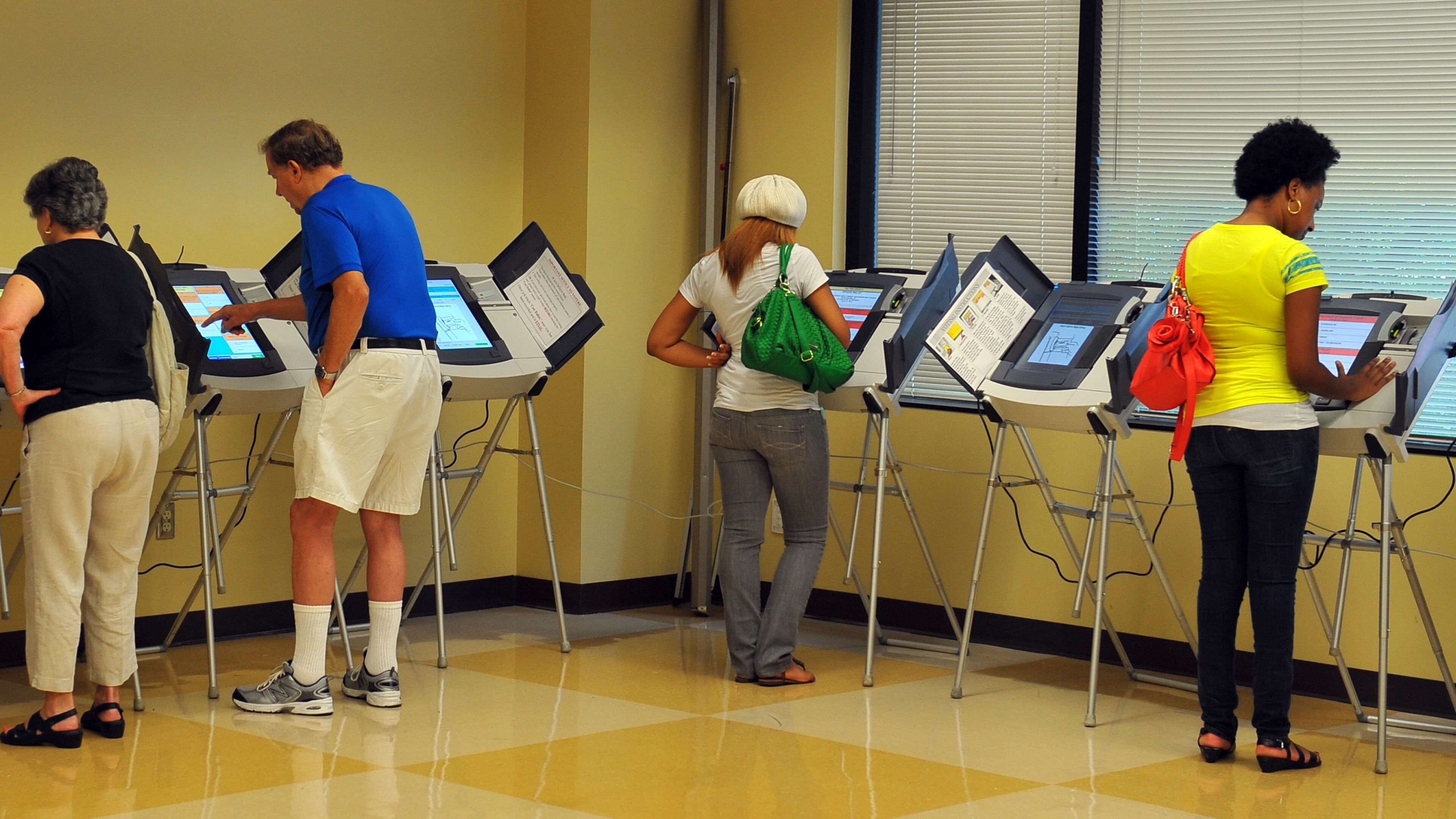 Voters take advantage of early voting on a Saturday. BRANT SANDERLIN / BSANDERLIN@AJC.COM