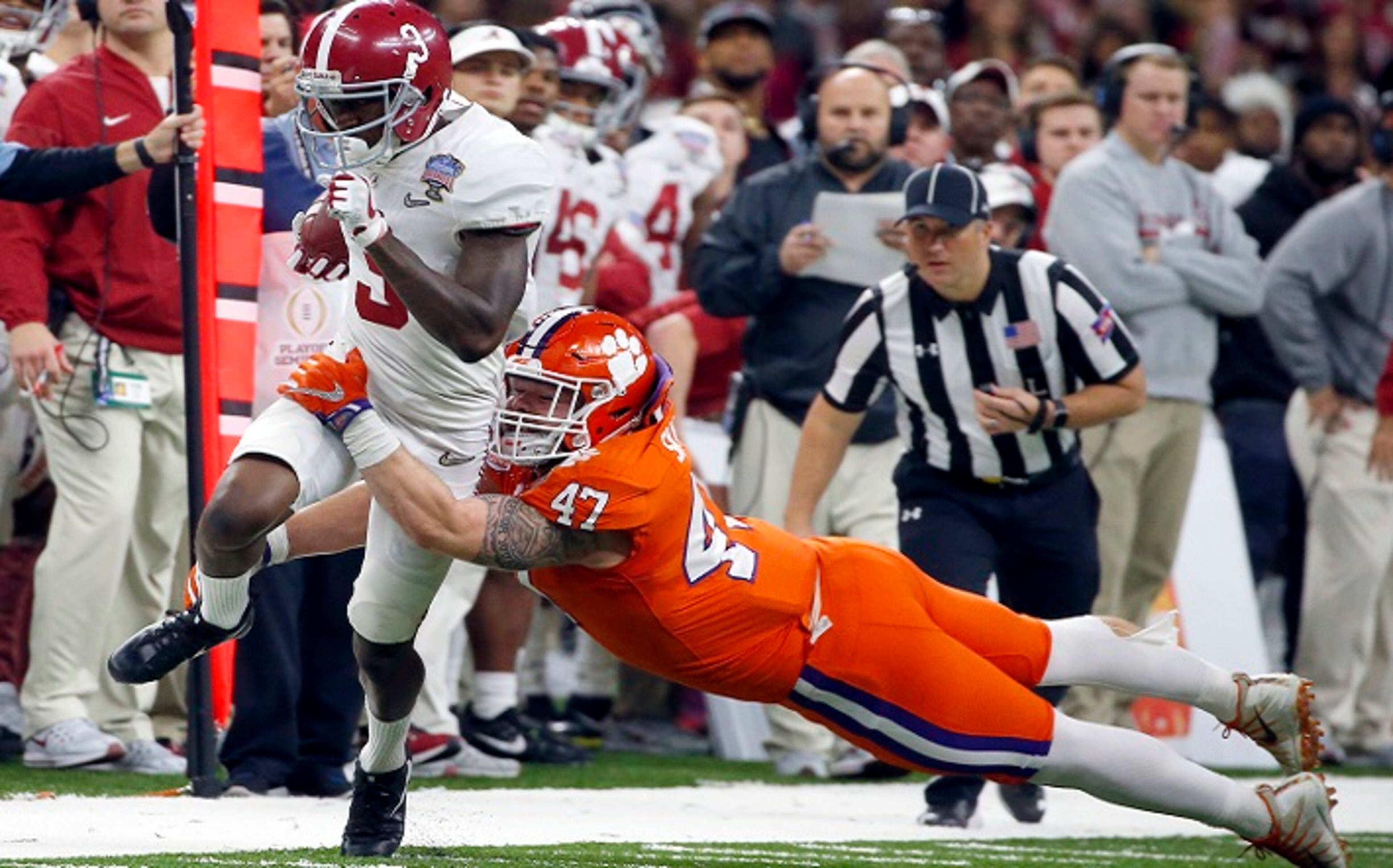 FILE - In this Monday, Jan. 1, 2018, file photo, Alabama wide receiver Calvin Ridley (3) is tackled by Clemson linebacker James Skalski (47) in the first half of the Sugar Bowl NCAA college football game in New Orleans. Ridley is a likely first-round NFL draft pick regarded as one of the nation's best at his position, but you might not have noticed watching the fourth-ranked Crimson Tide's last couple of games. Georgiaâs Javon Wims and Terry Godwin have yielded much of the spotlight to the Bulldogs heralded tailbacks also going into the Monday, Jan. 8, 2018, College Football national championship game. (AP Photo/Butch Dill, File)