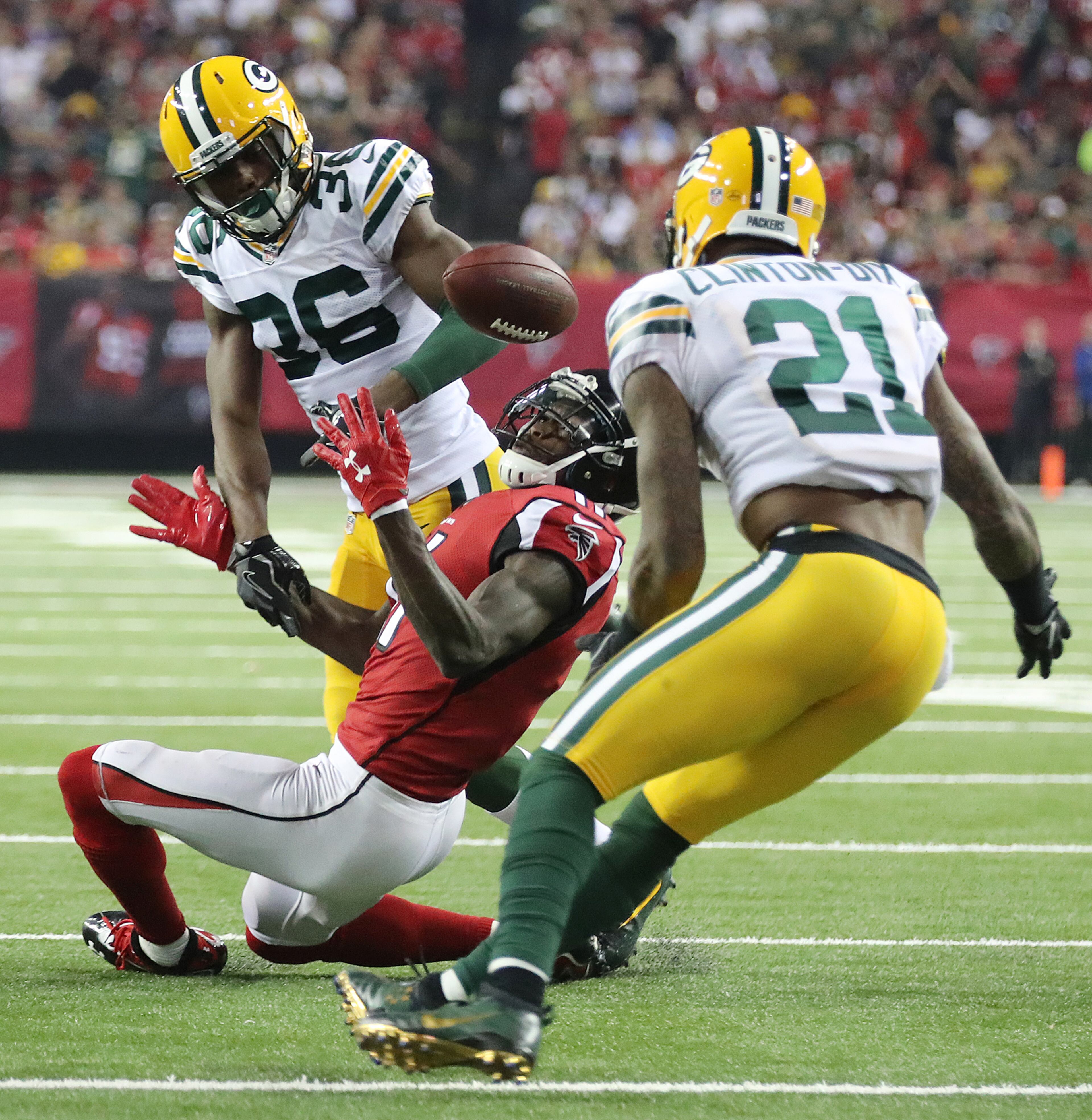 October 30, 2016 ATLANTA: Falcons wide receiver Julio Jones is double teamed by Packers conerback LaDarius Gunter and safety Ha Ha Clinton-Dix during the fourth quarter in an NFL football game on Sunday, Oct. 30, 2016, in Atlanta. Jones appeared to be looking for a penalty call after the play, but no call was made. Curtis Compton /ccompton@ajc.com