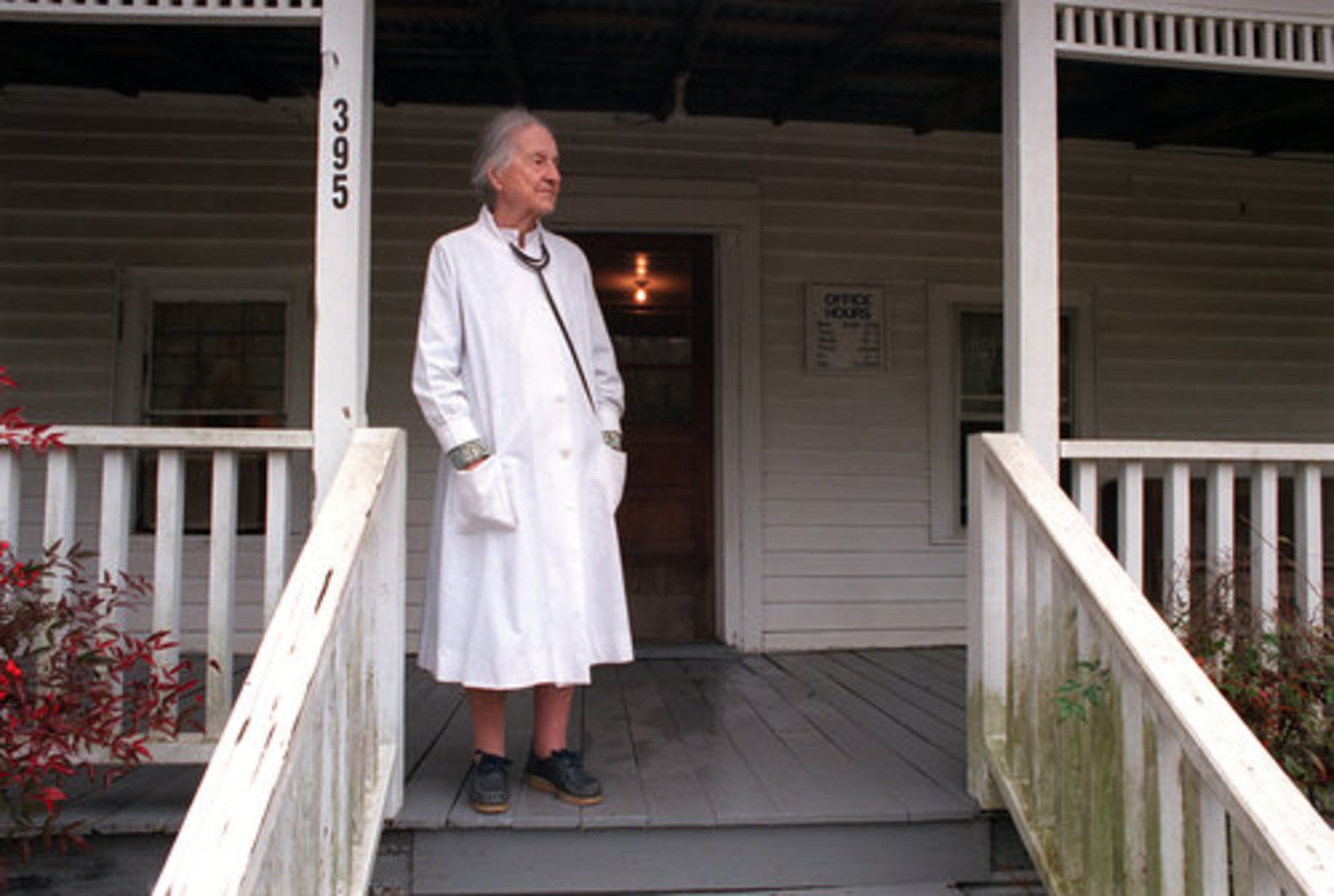 Denmark stands outside her clapboard farmhouse office in Alpharetta on Jan. 23, 1998, a month before turning 100.