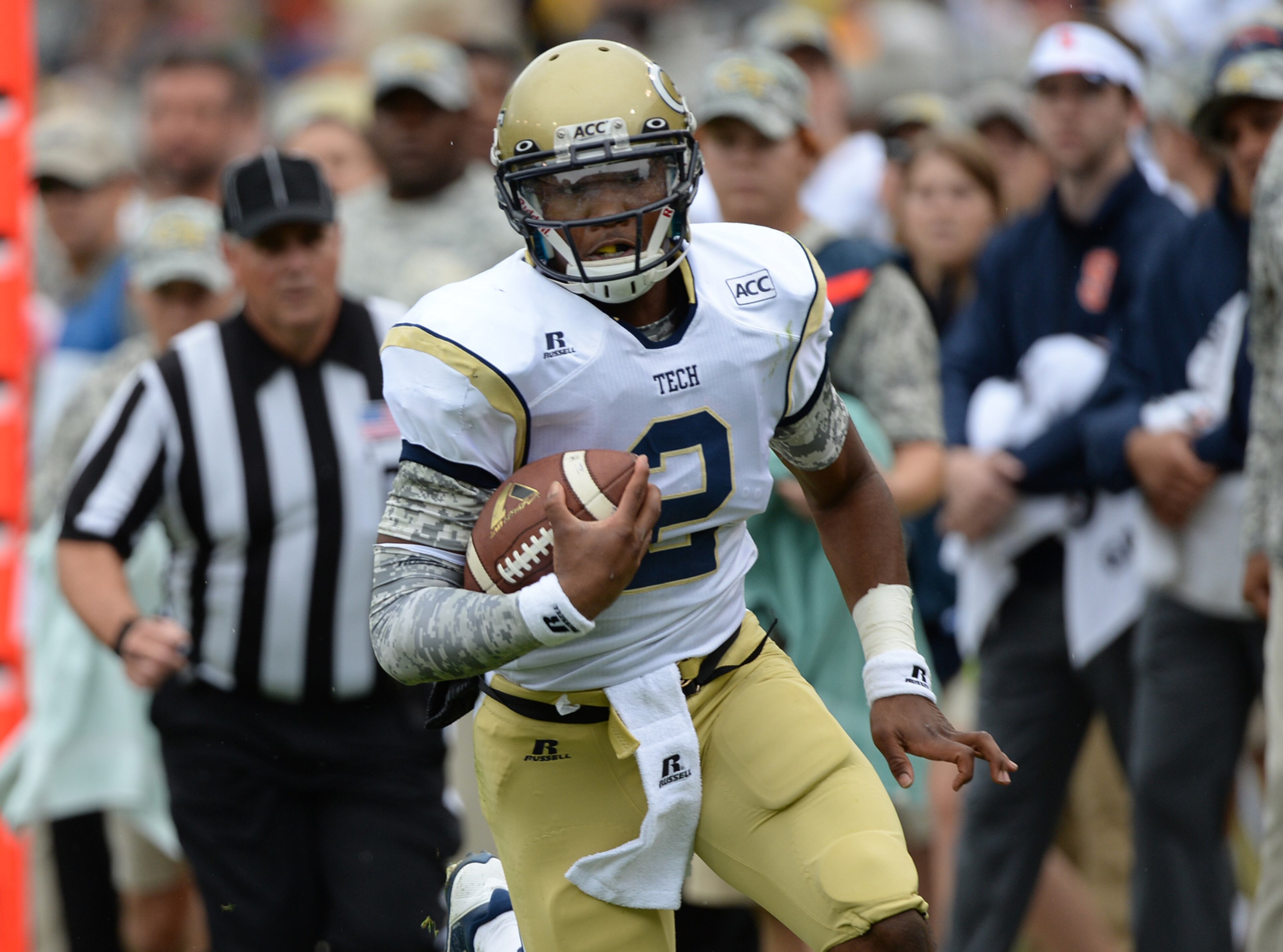 Georgia Tech's quarterback Vad Lee runs down the sideline for a first down during the football game in Bobby Dodd Stadium against Syracuse University on Saturday, October 19, 2013. Georgia Tech won the game 56-0.