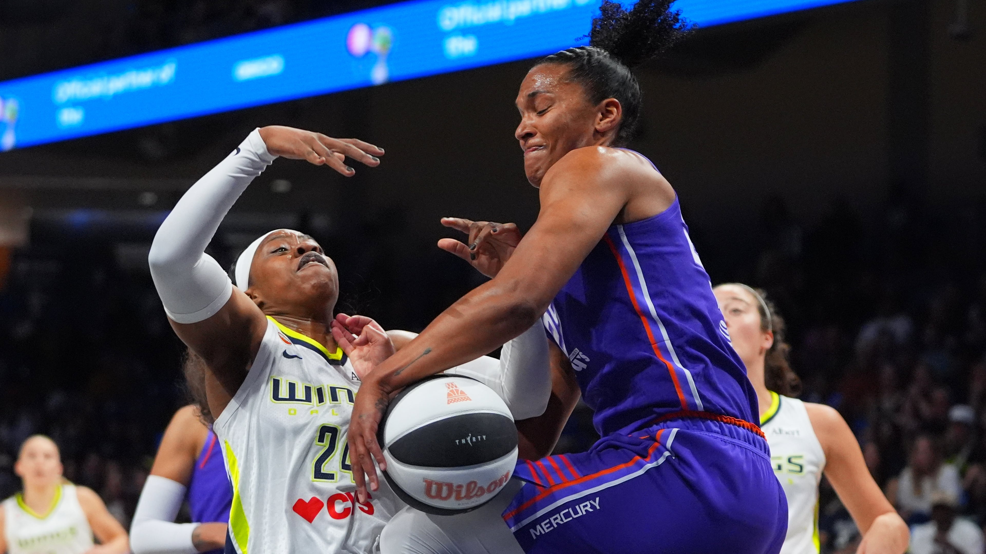 Phoenix Mercury forward Alyssa Thomas (25) strips the ball from Dallas Wings guard Arike Ogunbowale (24) during the first half of a WNBA basketball game in Arlington, Texas, Thursday, June 11, 2026. (AP Photo/LM Otero)