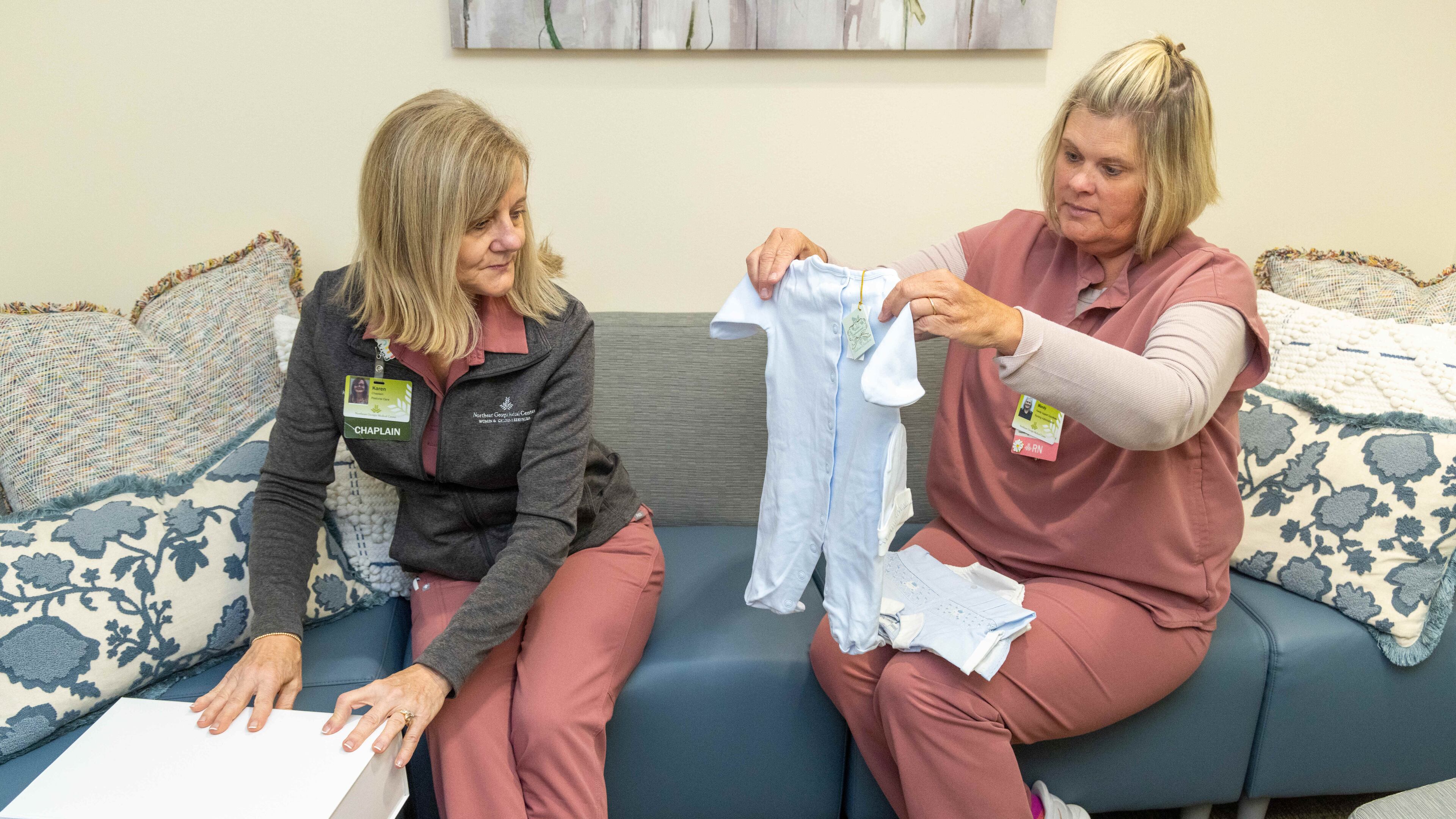 Northeast Georgia Medical Center Bereavement team members Chaplain Reverend Karen Hoyt M.Div, BCC (left) & Mandy Reichert, PhD, RN, PT-CSP look through their assortment of baby clothes that they can offer for burials. A nurse who has the sad duty of dressing for burial babies that don't make it contacted a manufacturer of really smart children's clothes. He has given them some and they are needed because some parents don't have or can't afford a proper burial outfit for their babies. For Inspire Atlanta about nurses going above and beyond. PHIL SKINNER FOR THE ATLANTA JOURNAL-CONSTITUTION