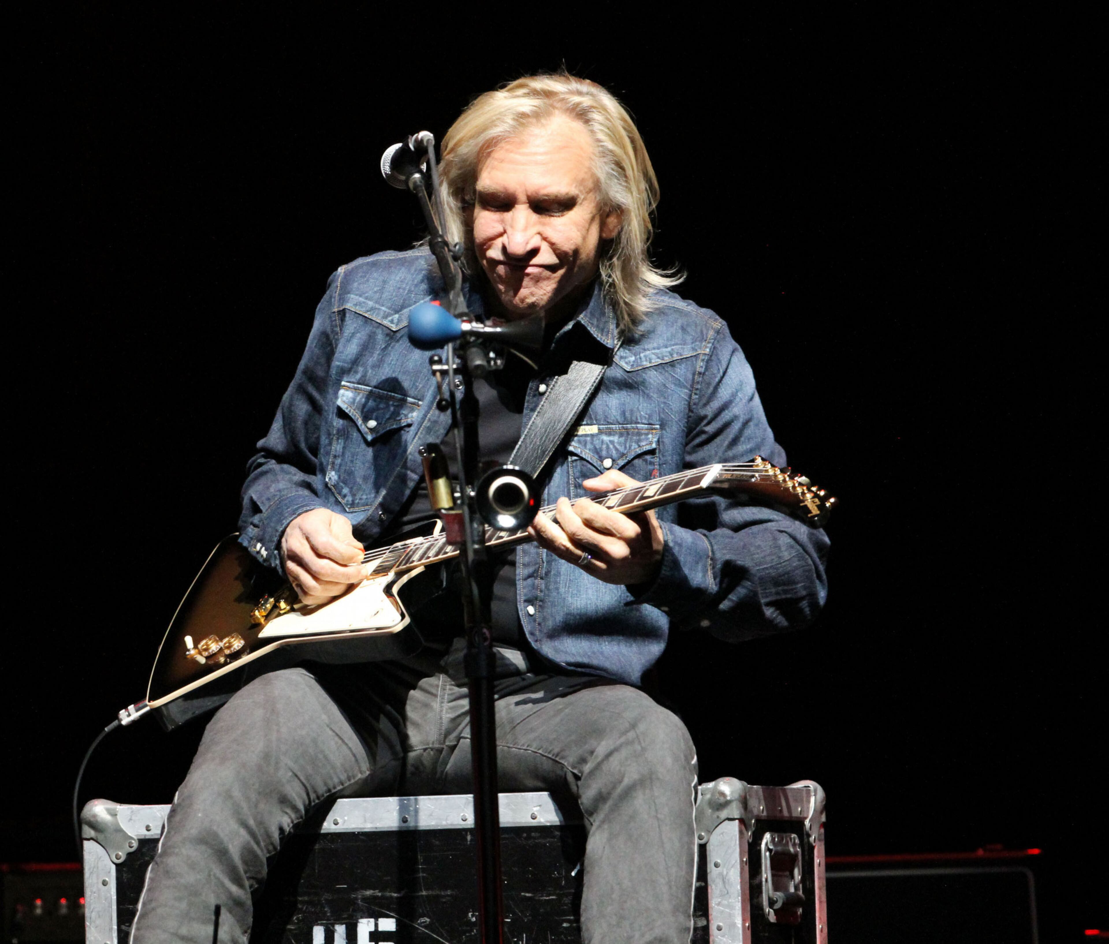 Joe Walsh plays on "Witchy Woman" Feb. 24, 2014 at Philips Arena in Atlanta.