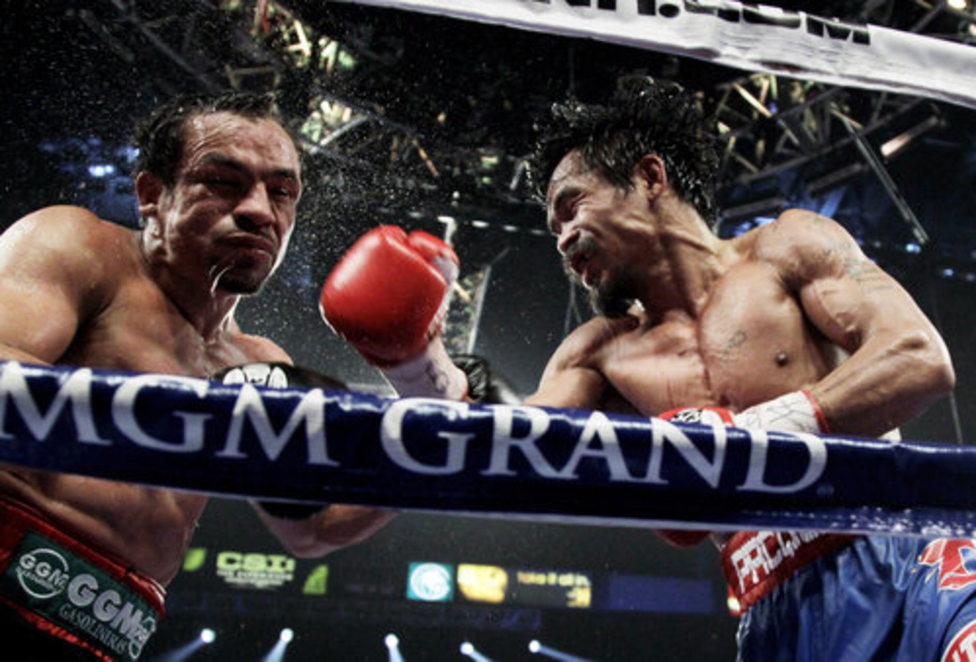 Pacquiao and Marquez battle it out against the ropes.