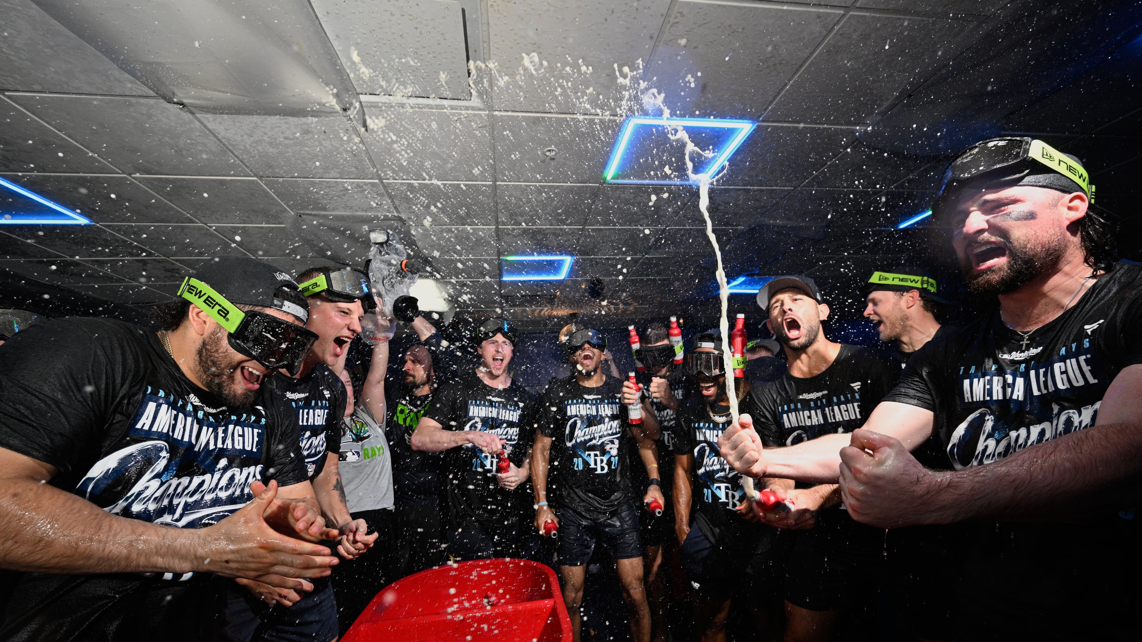 The Tampa Bay Rays celebrate their win in the locker room against the Cleveland Guardians in Game 6 of an American League Championship Series baseball game in St. Petersburg, Fla. Monday, Oct. 19, 2026.(AP Photo/Phelan M. Ebenhack)