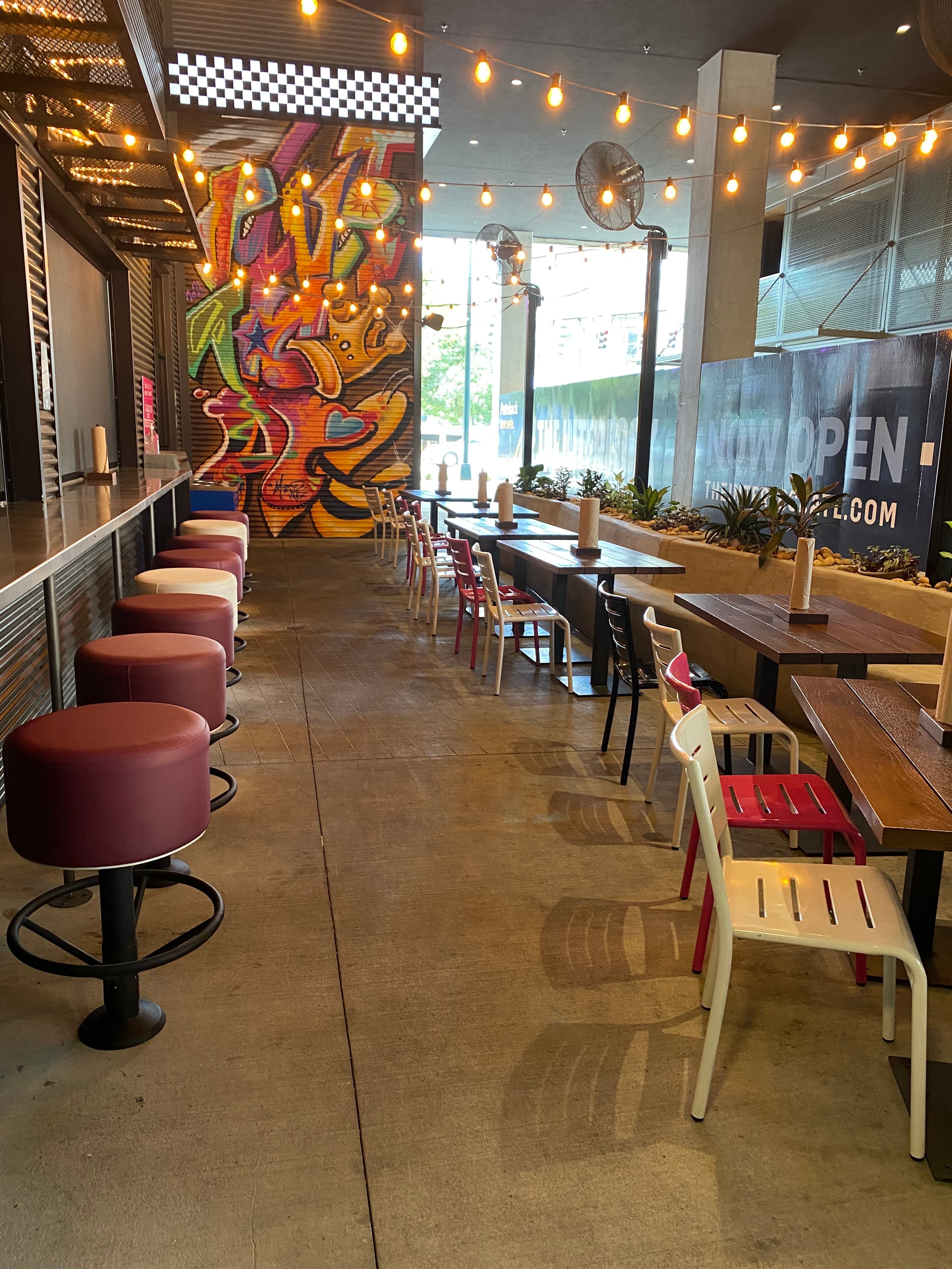 Velvet Taco offers indoor dining as well as outdoor seating on a covered patio breezeway that connects shops at the Interlock. (Ligaya Figueras / ligaya.figueras@ajc.com)