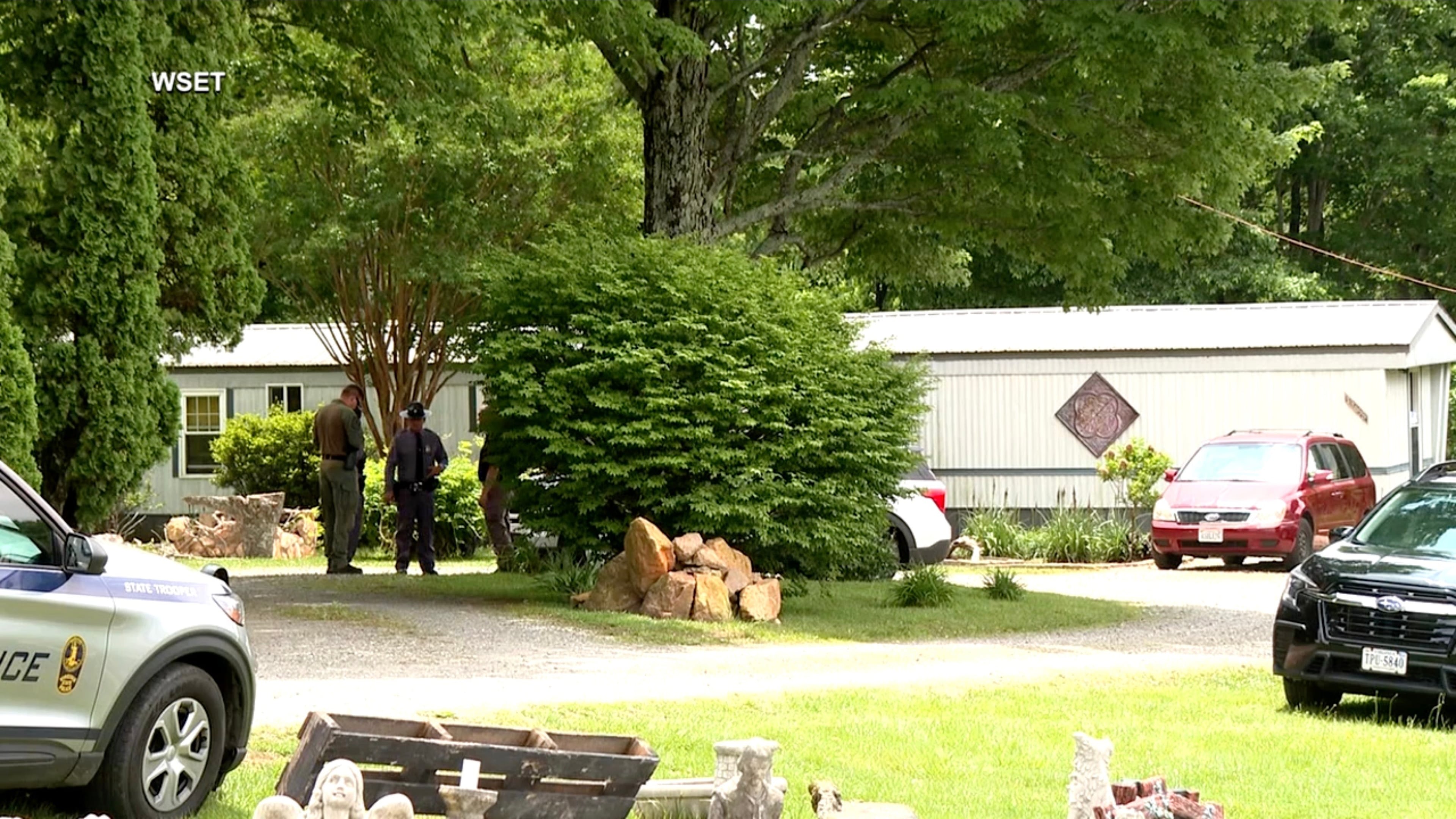 This image taken from video shows law enforcement at the scene of Michael Puckett's home in Carroll County, Va., on Saturday, May 30, 2026. (WSET via AP)