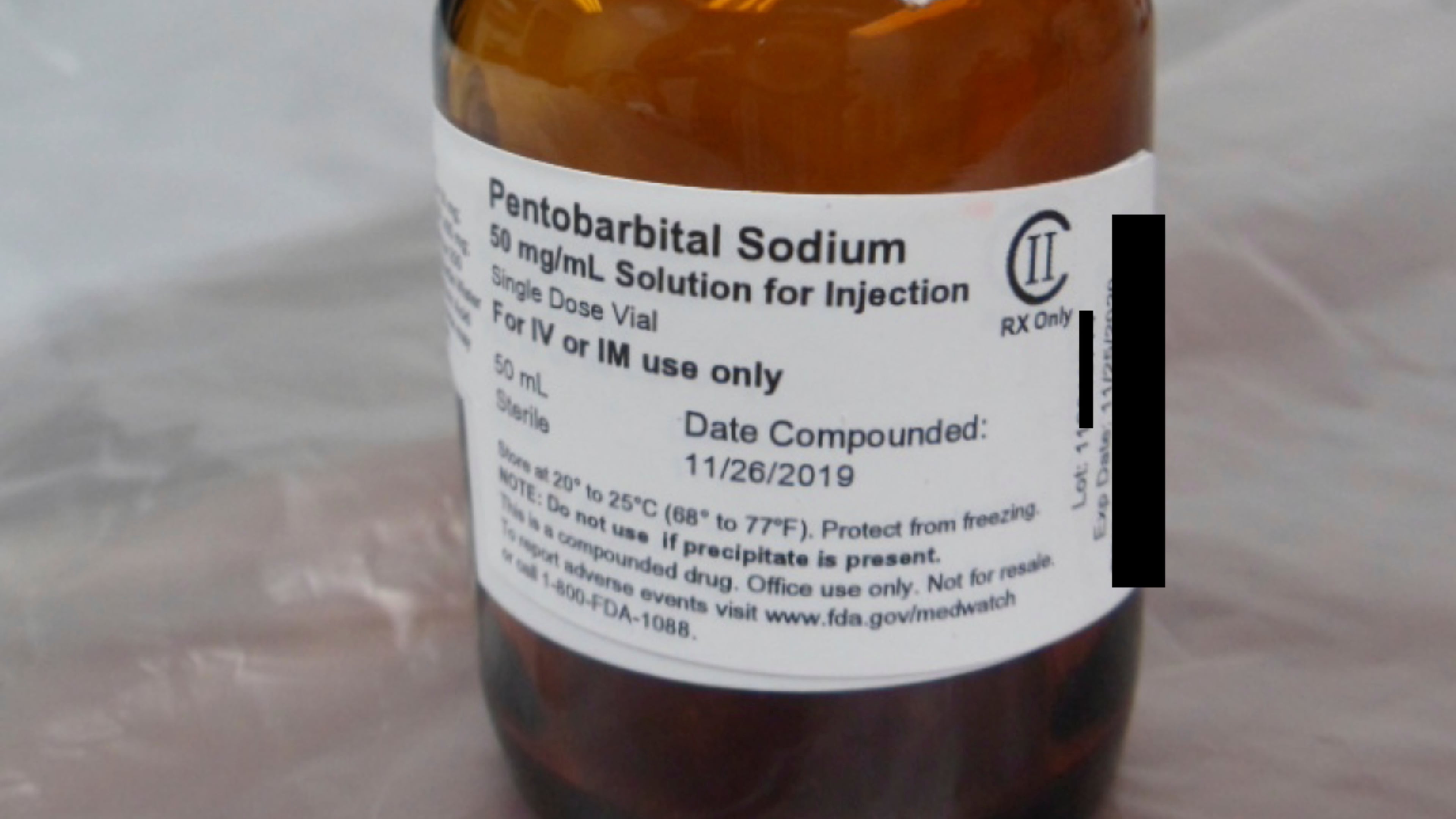 FILE - This photo provided by the U.S. Department of Justice shows a vial of pentobarbital used in the executions of two inmates in July 2020, according to court filings. The photo was filed in U.S. District Court in Washington on Aug. 13, 2020, as part of litigation over the use of pentobarbital in executions. (Department of Justice via AP, File)