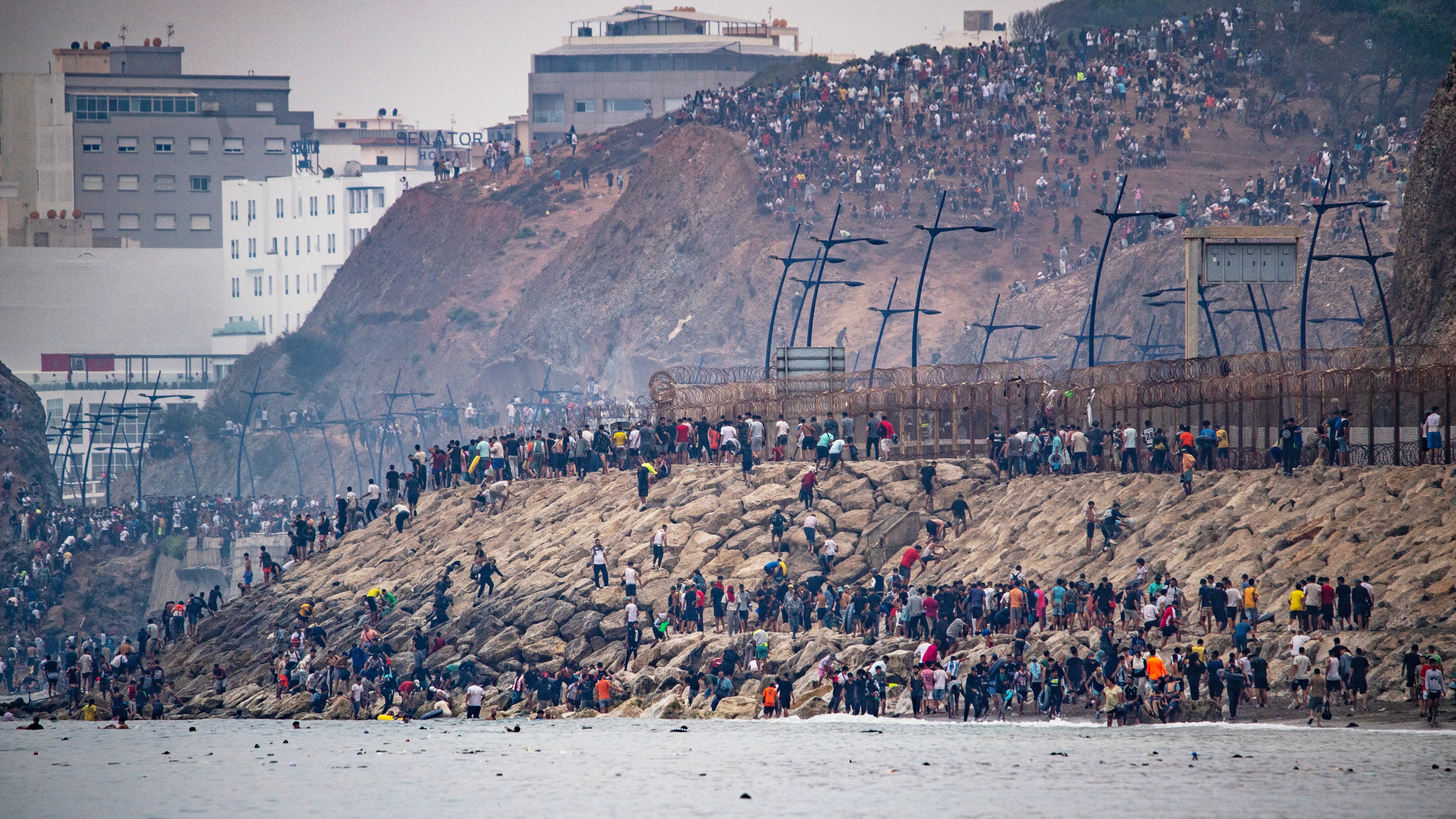 Migrants return to Morocco from the Spanish enclave of Ceuta, Friday, July 31, 2026. (AP Photo/Antonio Sempere)