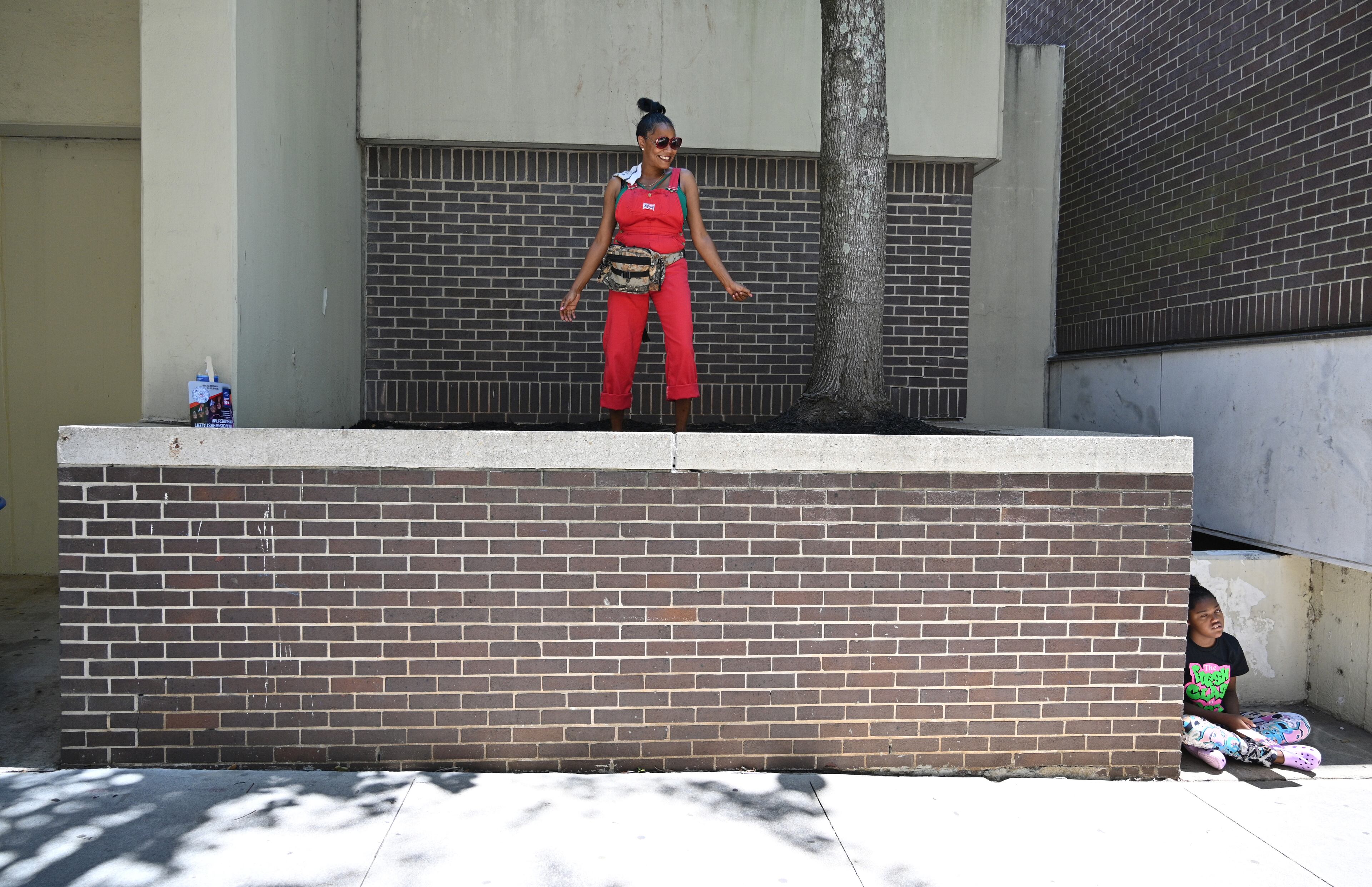 A spectator dances as a float makes its way down during the Juneteenth Atlanta Black History Parade on Saturday, June 18, 2022. (Hyosub Shin / Hyosub.Shin@ajc.com)