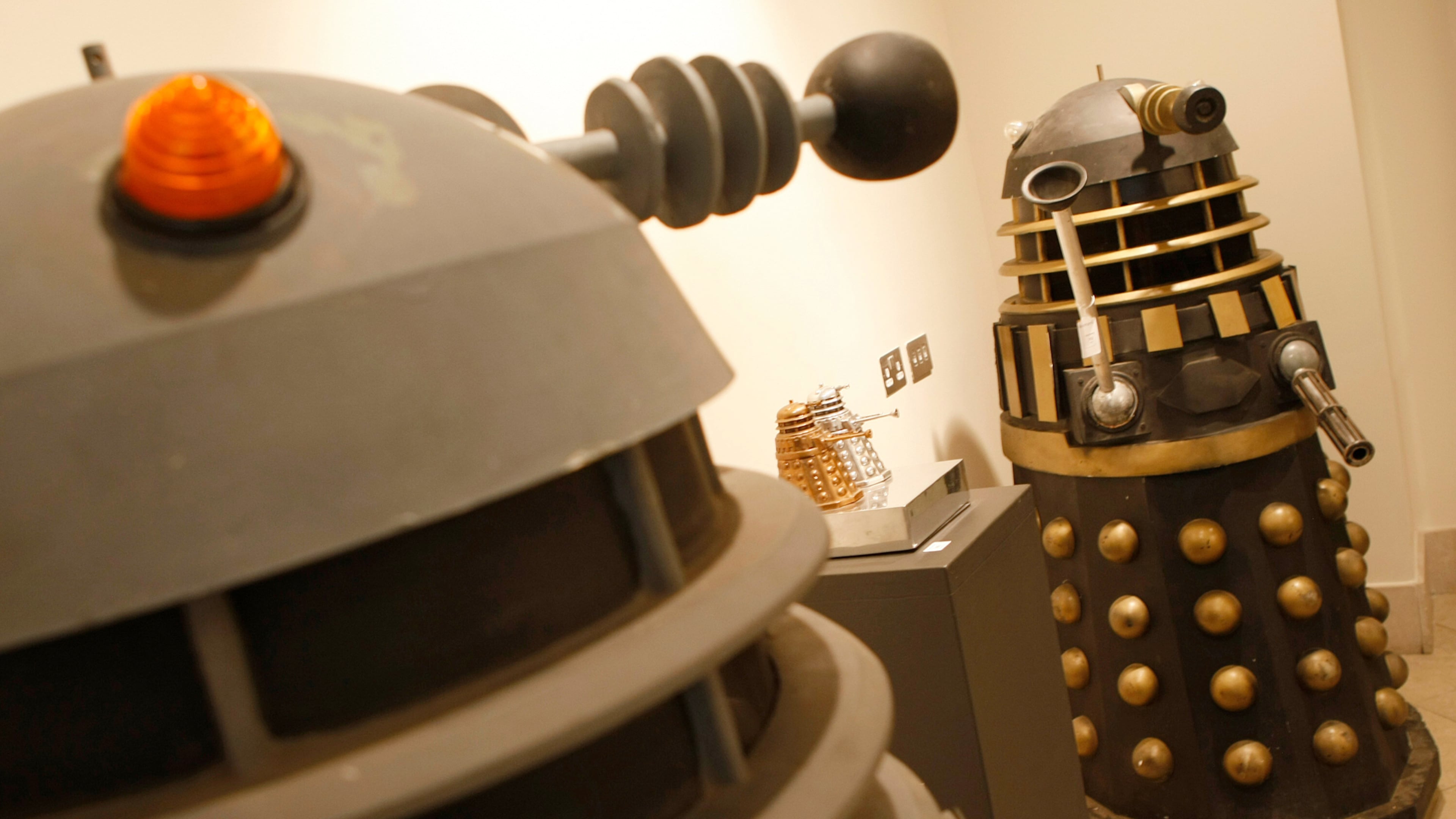 FILE - Two full size Daleks from the BBC TV series Doctor Who, dating from the late 1970,s to 1988 and used in the series 'Remembrance of the Daleks' at Bonhams auction house in London, Monday, Aug. 2, 2010. (AP Photo/Alastair Grant, file)