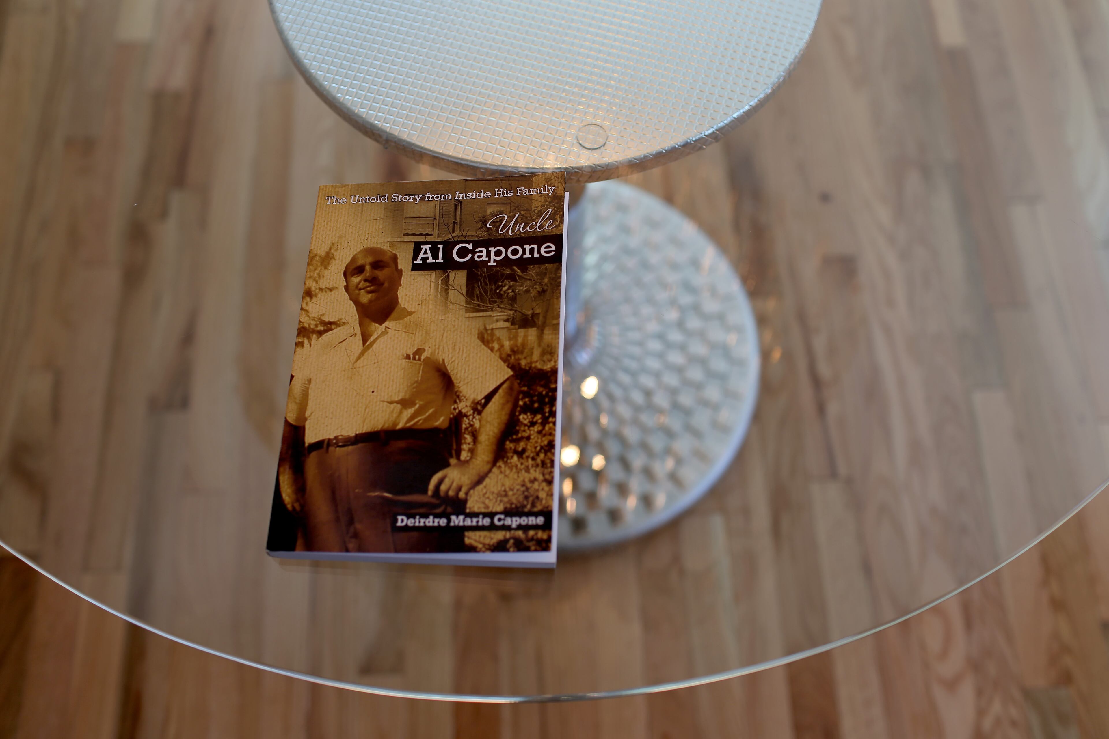 MIAMI BEACH, FL - MARCH 18: A book featuring a picture of Al Capone is seen in his former home during a tour of the historic house on March 18, 2015 in Miami Beach, Florida. The home being restored by MB America was built in 1922 and bought by the prohibition-era gangster in 1928, the property, now renamed 93 Palm, is one of Miamis oldest and most notorious estates. The colonial-style, seven-bedroom property features three houses - the gate house, the main villa and the pool cabana. (Photo by Joe Raedle/Getty Images)