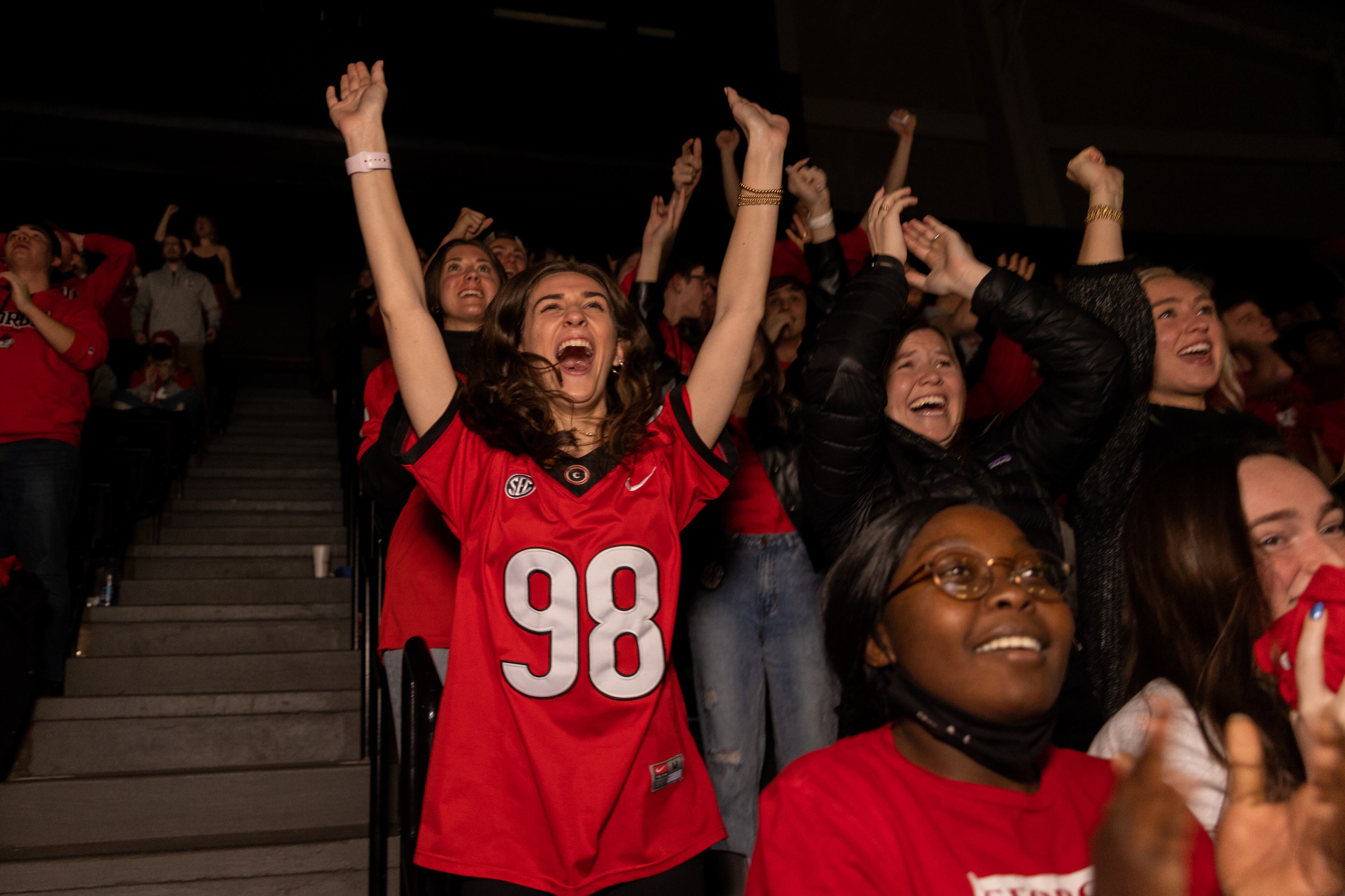 Georgia Bulldogs fans celebrate during the fourth quarter of the College Football Playoff national championship game at a watch party at Stegeman Coliseum on the University of Georgia campus on Monday, January 10, 2022. (Photo: Nathan Posner for The Atlanta Journal-Constitution)