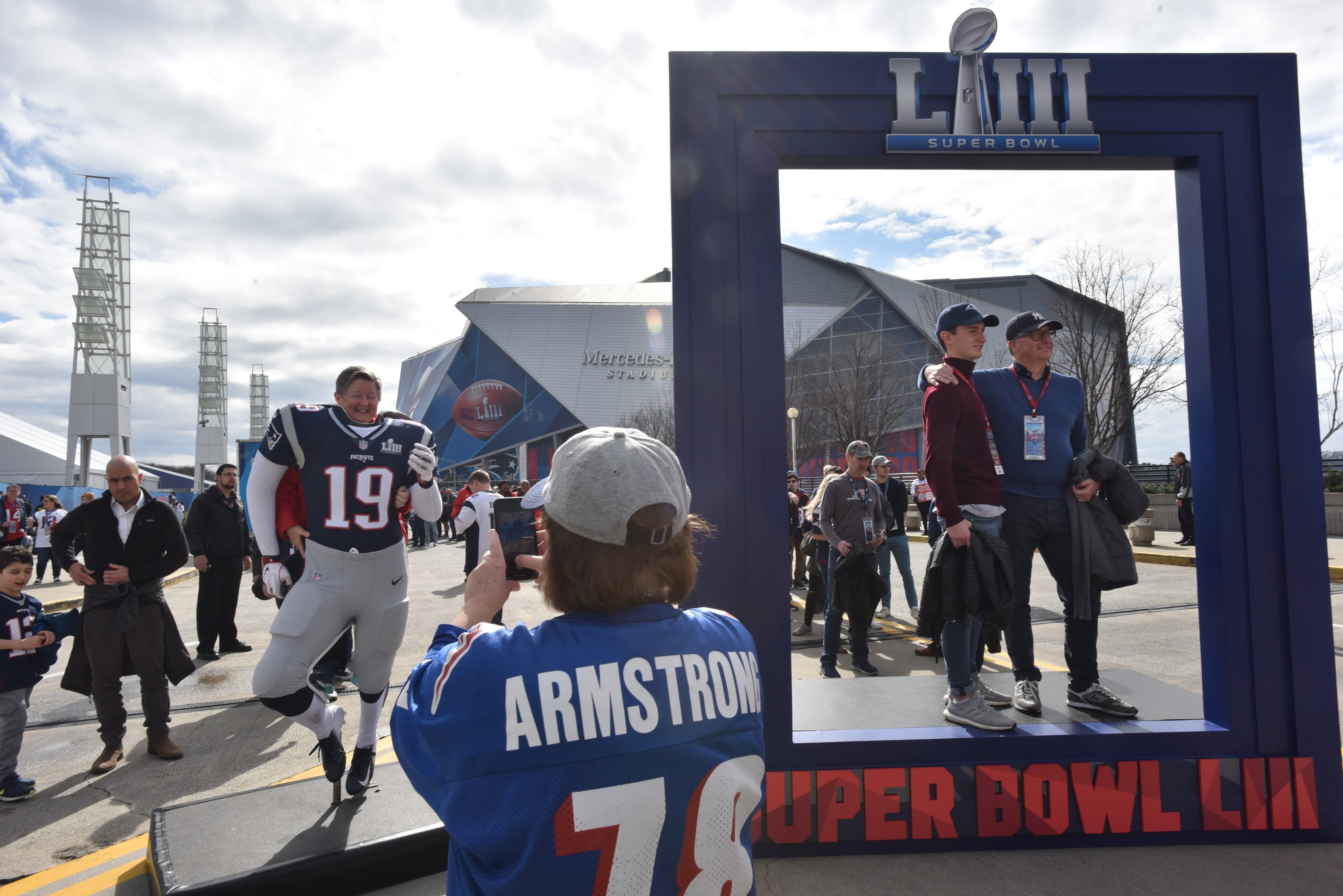 February 3, 2019 Atlanta - Fans pose for photograph outside Mercedes-Benz Stadium ahead of the Super Bowl game between Los Angeles Rams and New England Patriots on Saturday, February 3, 2019. HYOSUB SHIN / HSHIN@AJC.COM