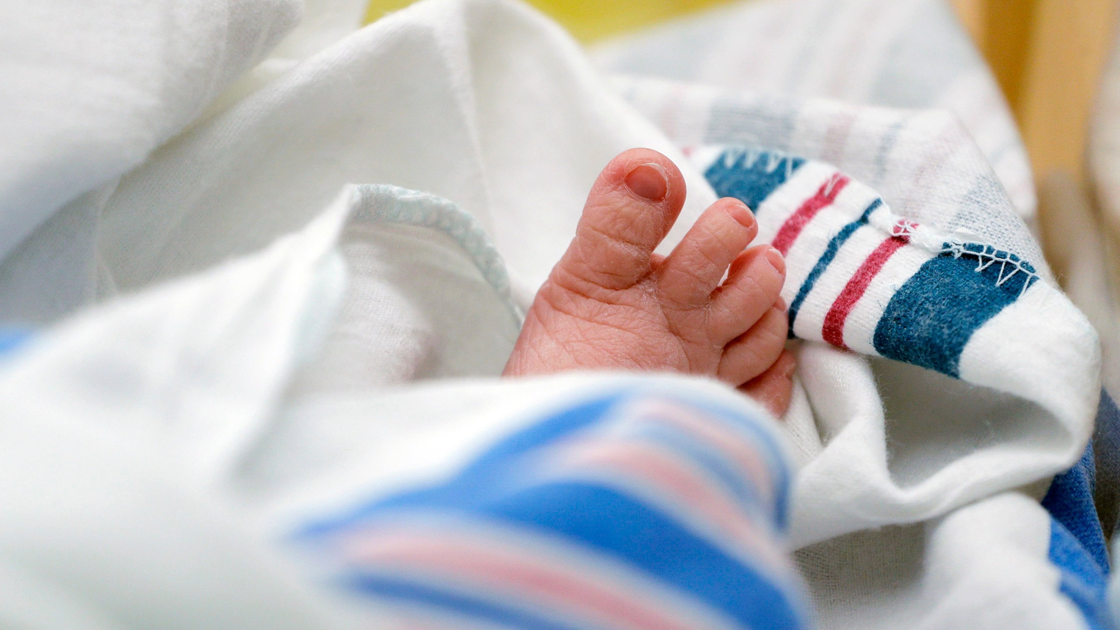 FILE - The toes of a baby peek out of a blanket at a hospital in McAllen, Texas, July, 29, 2020. (AP Photo/Eric Gay, File)