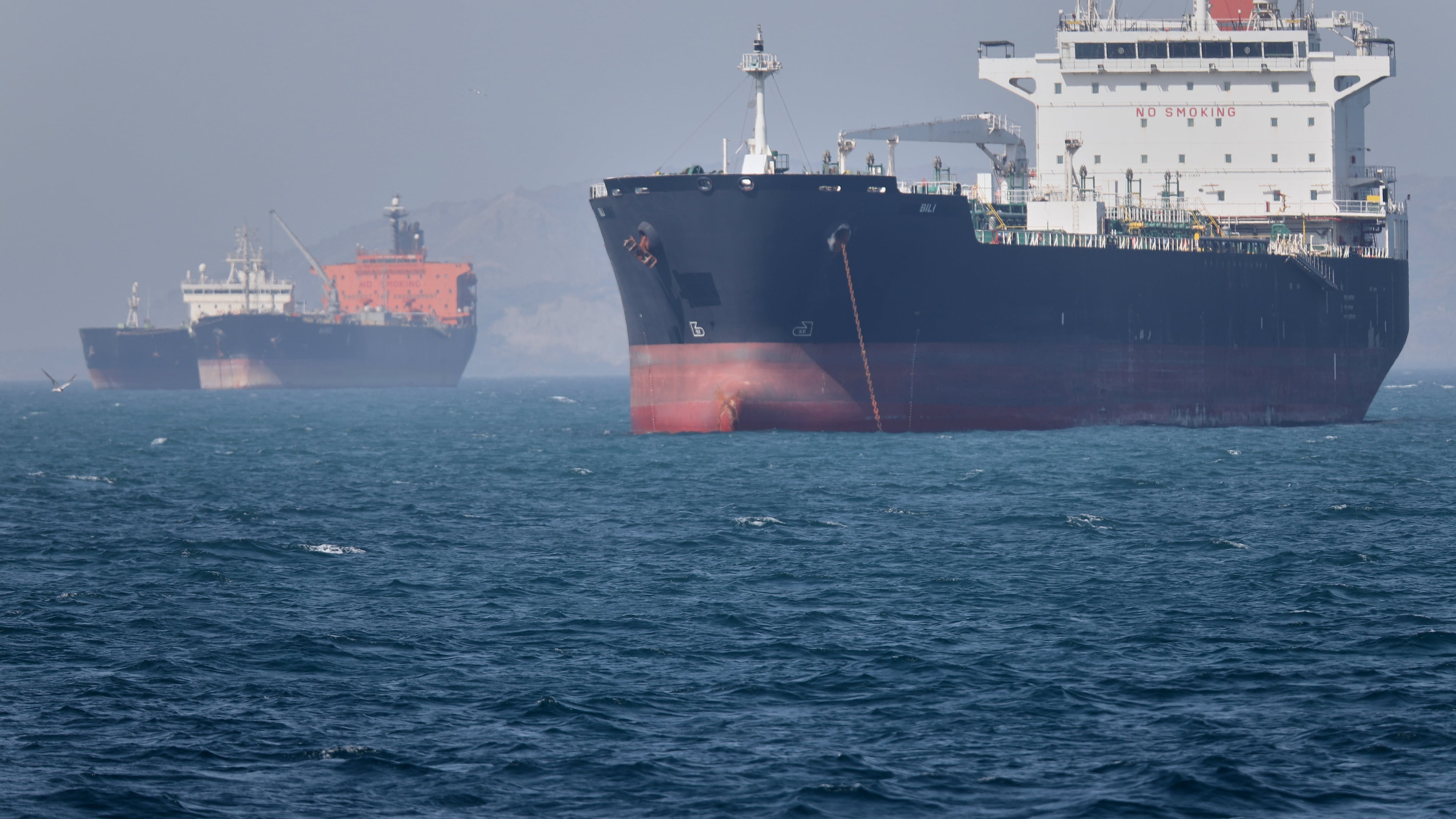 Oil tankers sit at anchor offshore in the Strait of Hormuz off Bandar Abbas, Iran, Saturday, May 2, 2026. (Amirhosein Khorgooi/ISNA via AP)
