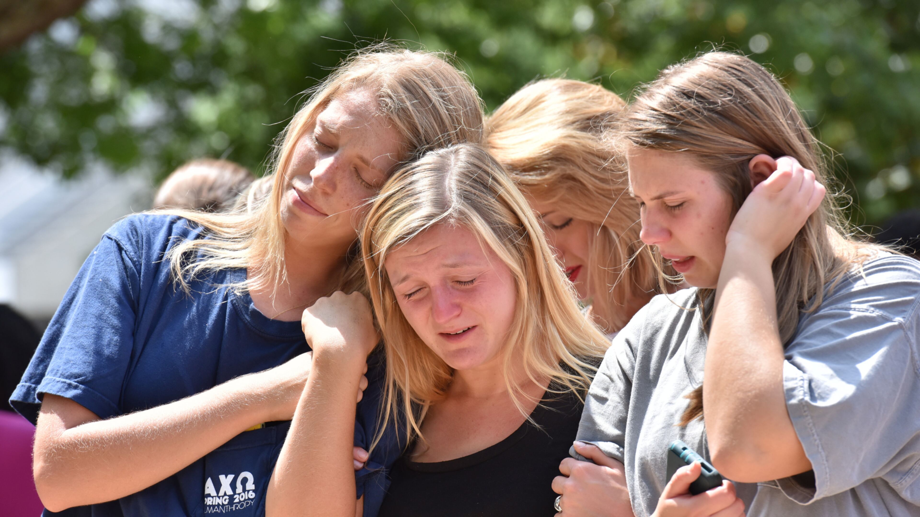 EMOTIONS SPILL OVER--April 28, 2016 Athens - Students gather to mourn the deaths of fellow UGA students at a memorial organized by The Field at Tate Plaza on campus on Thursday, April 28, 2016. Just days before the end of the school year, tragedy struck the University of Georgia community. A two-vehicle crash Wednesday night killed four students and left a fifth in critical condition. HYOSUB SHIN / HSHIN@AJC.COM