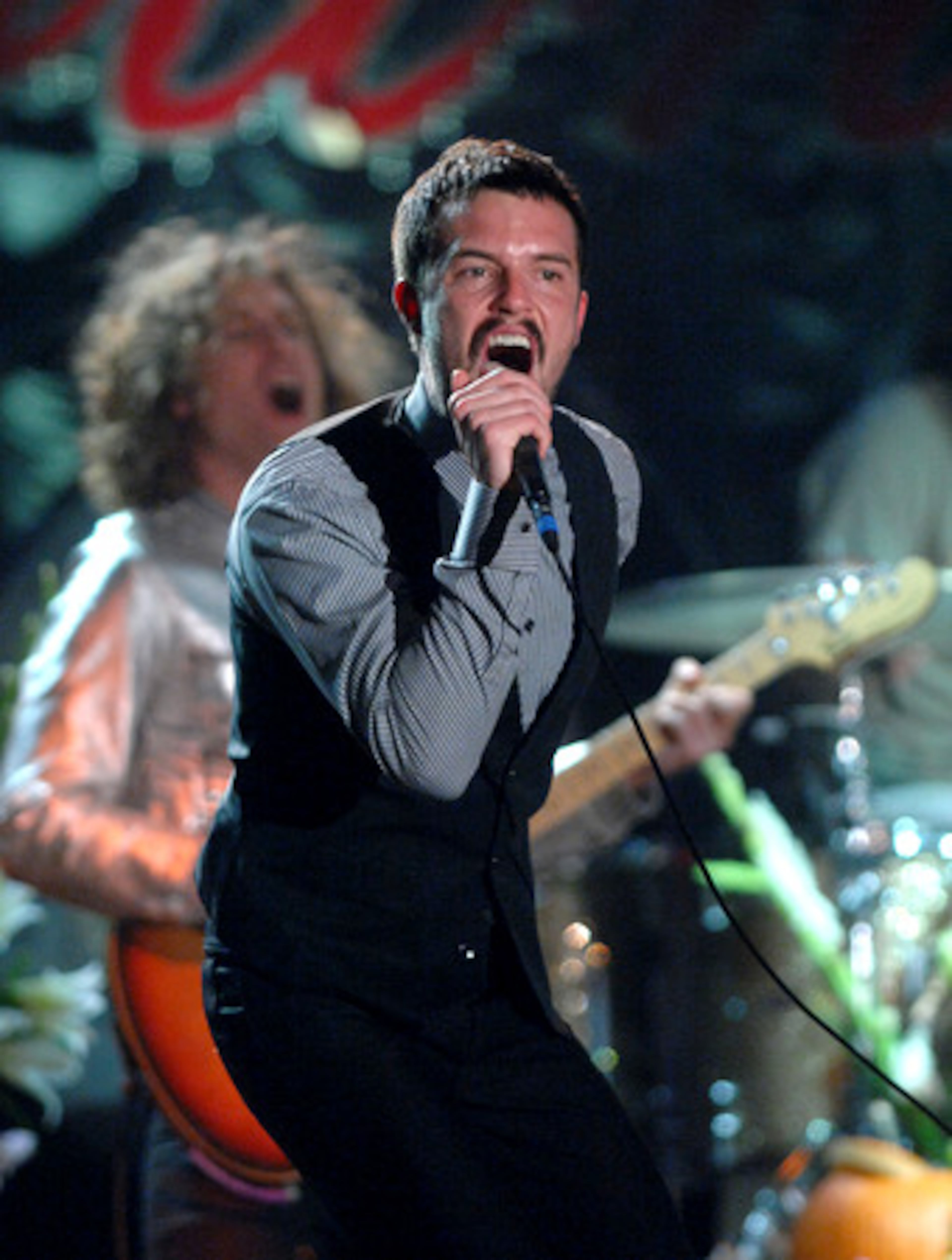 Brandon Flowers, lead singer for The Killers, performs late Saturday.