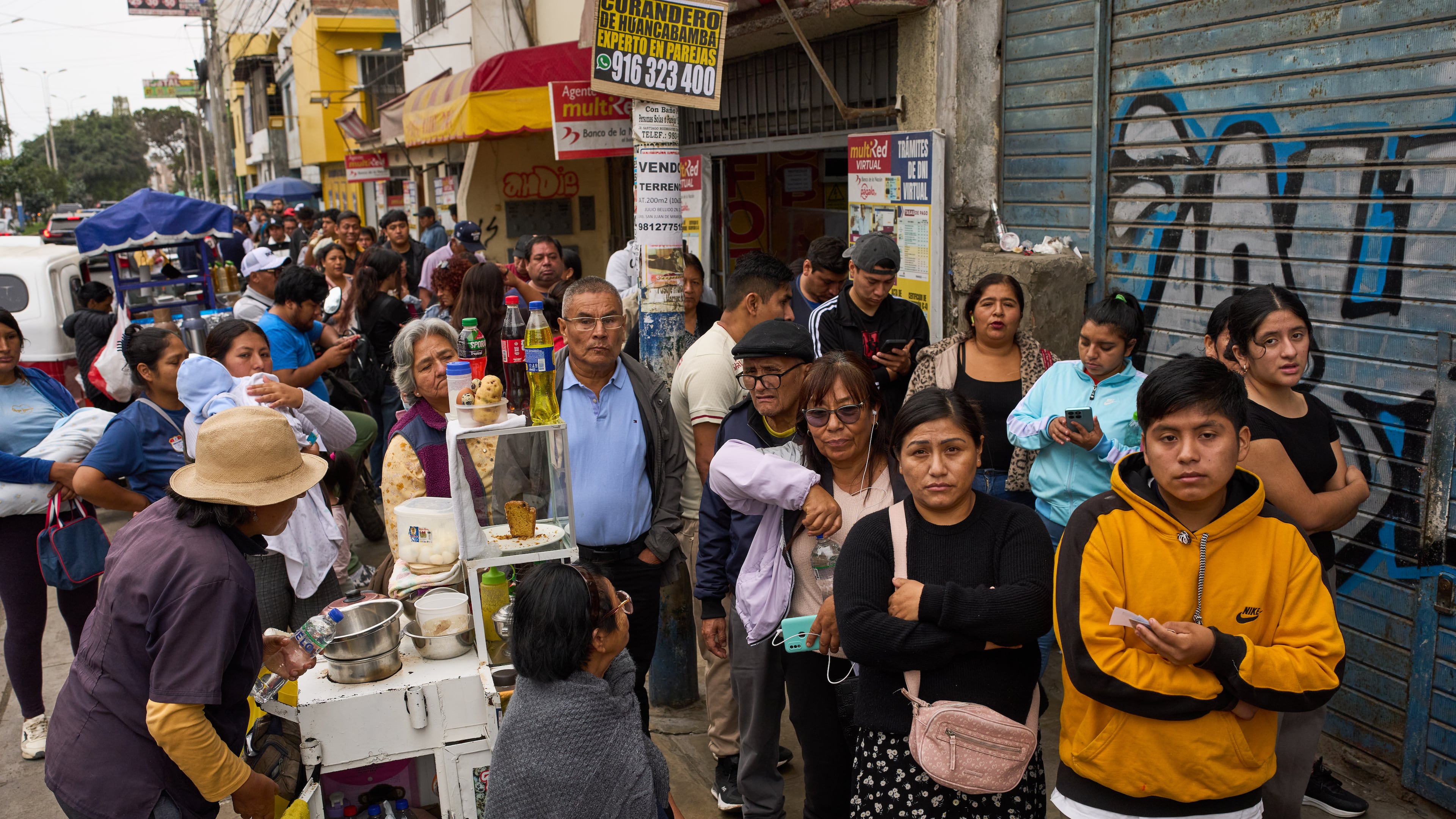 People line up to collect their national identity cards ahead of Peru's presidential runoff election in Lima, Peru, Saturday, June 6, 2026. (AP Photo/Rodrigo Abd)