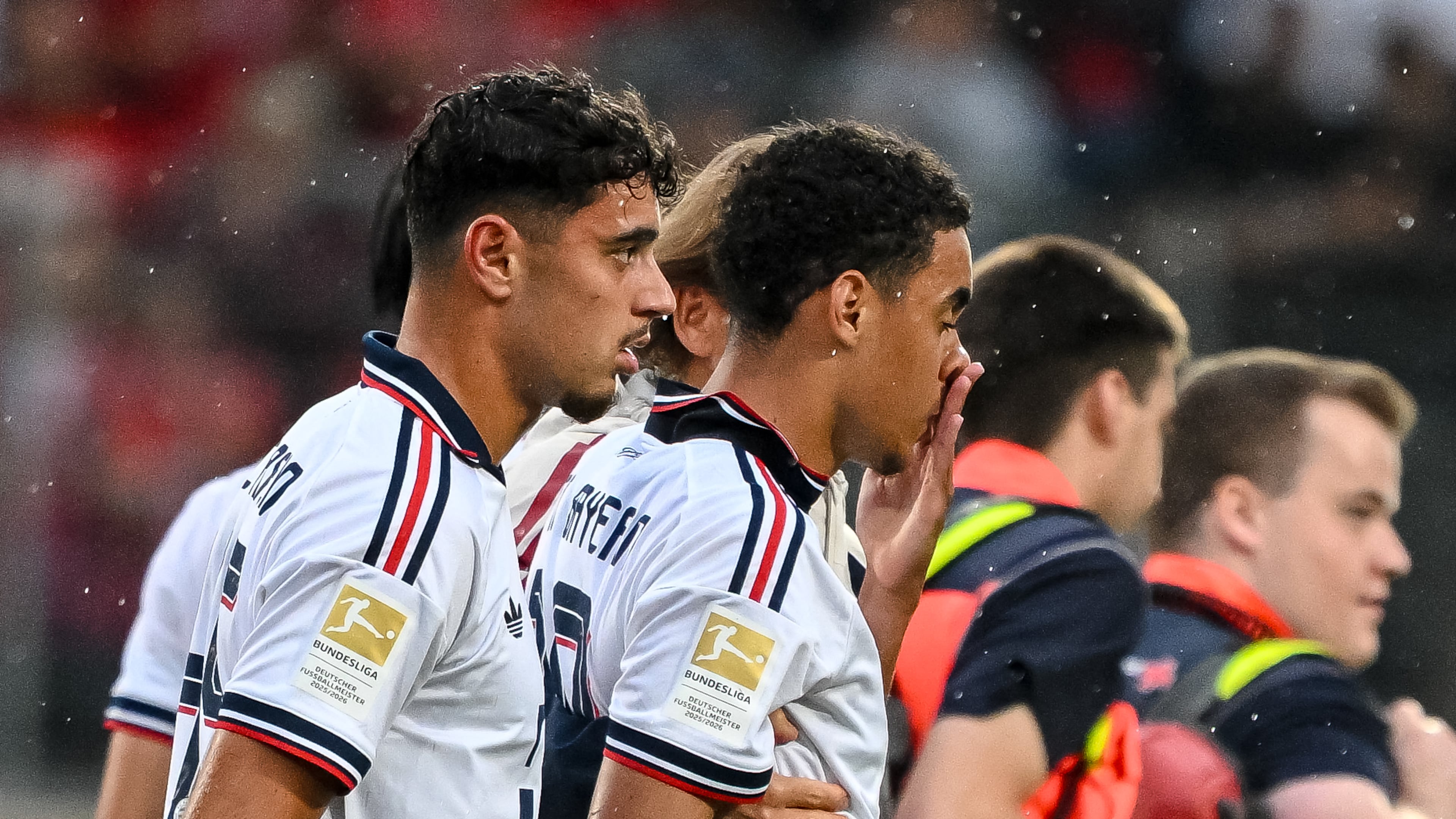 Bayern's Jamal Musiala, second left, leaves the field during a friendly soccer match between FC Heidenheim and FC Bayern Munich in Heidenheim, Germany, Tuesday, Aug. 18, 2026. (Harry Langer/DeFodi/dpa via AP)